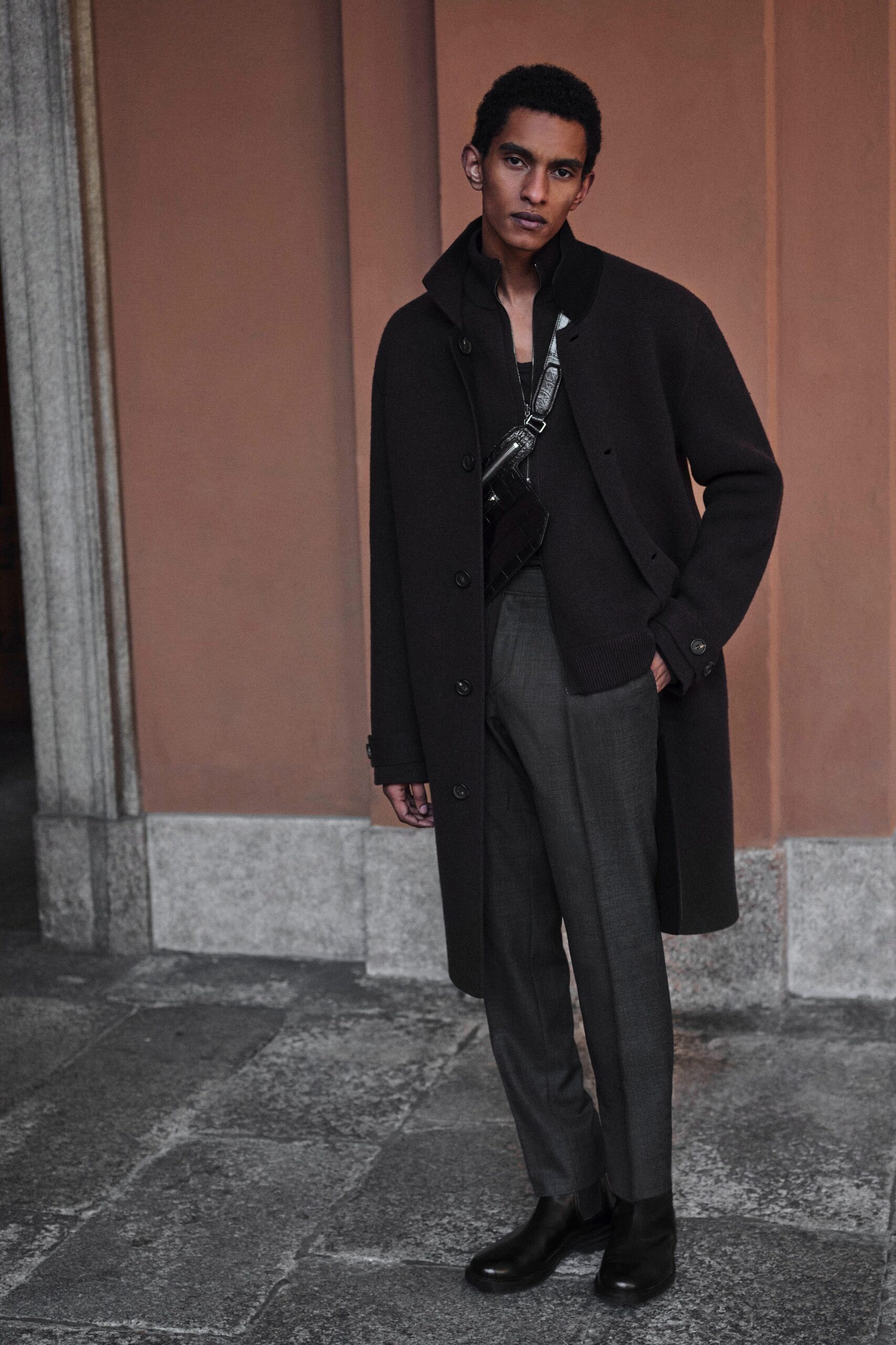 black wool coat with gray pants