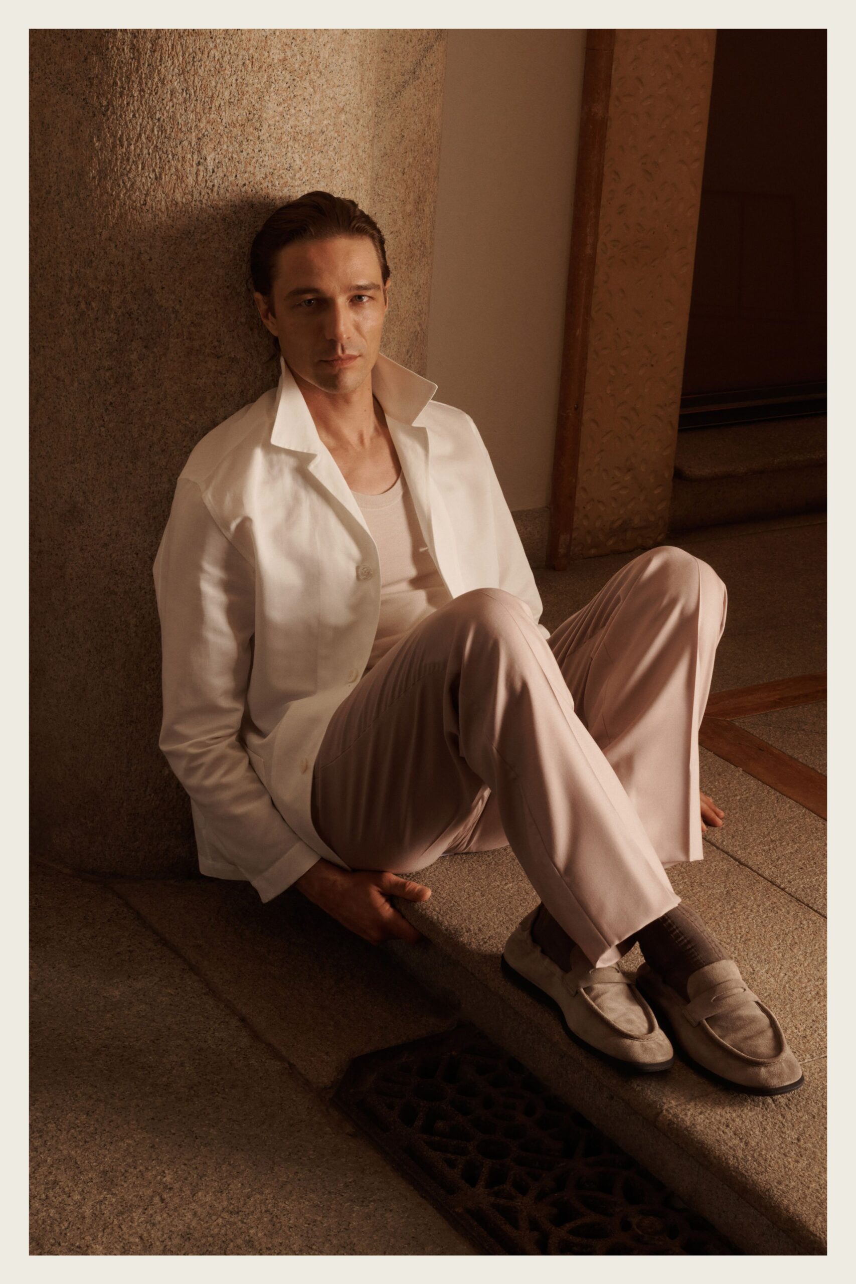 white silk long-sleeve collared structured buttoned shiny jacket