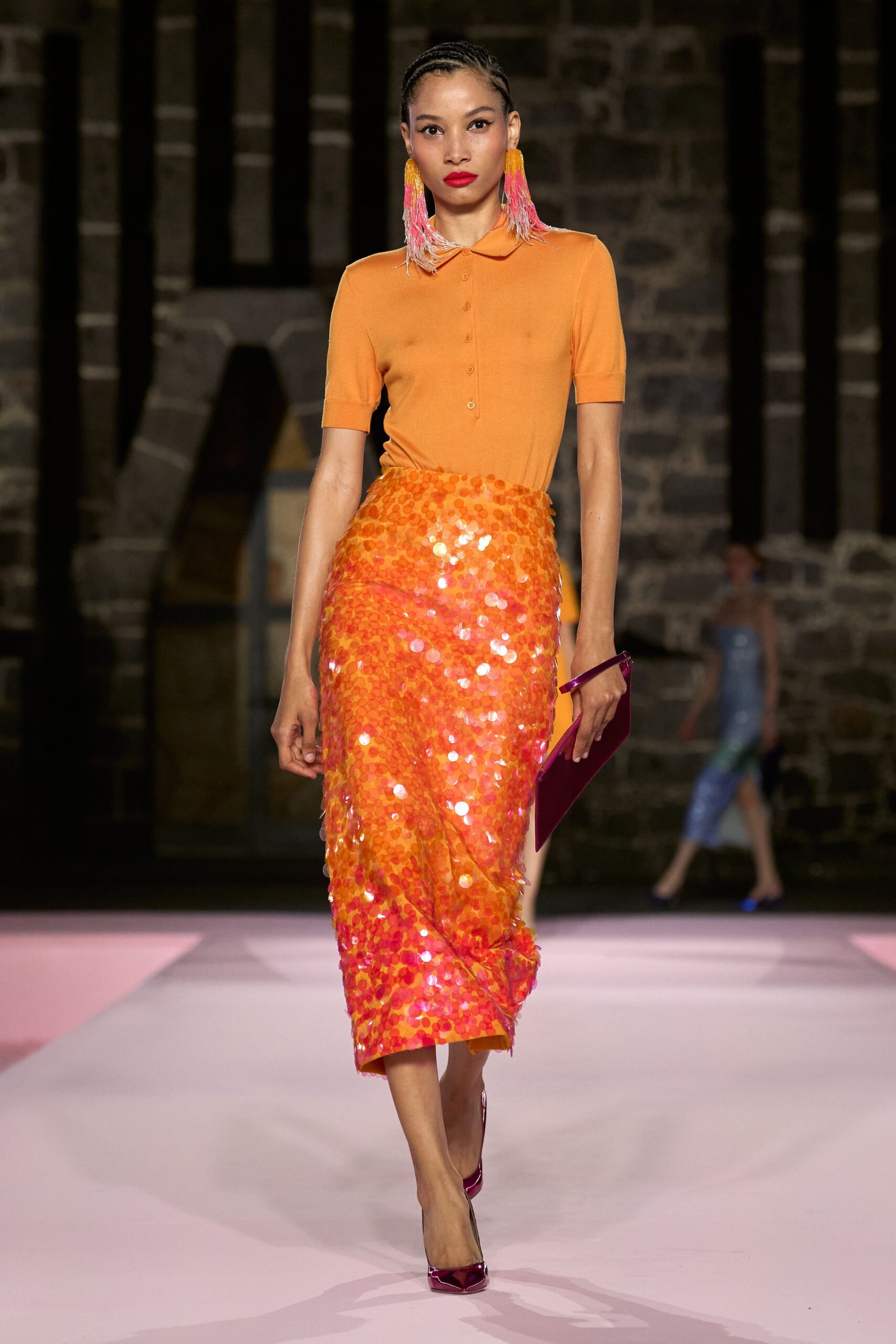 orange fitted top and midi skirt