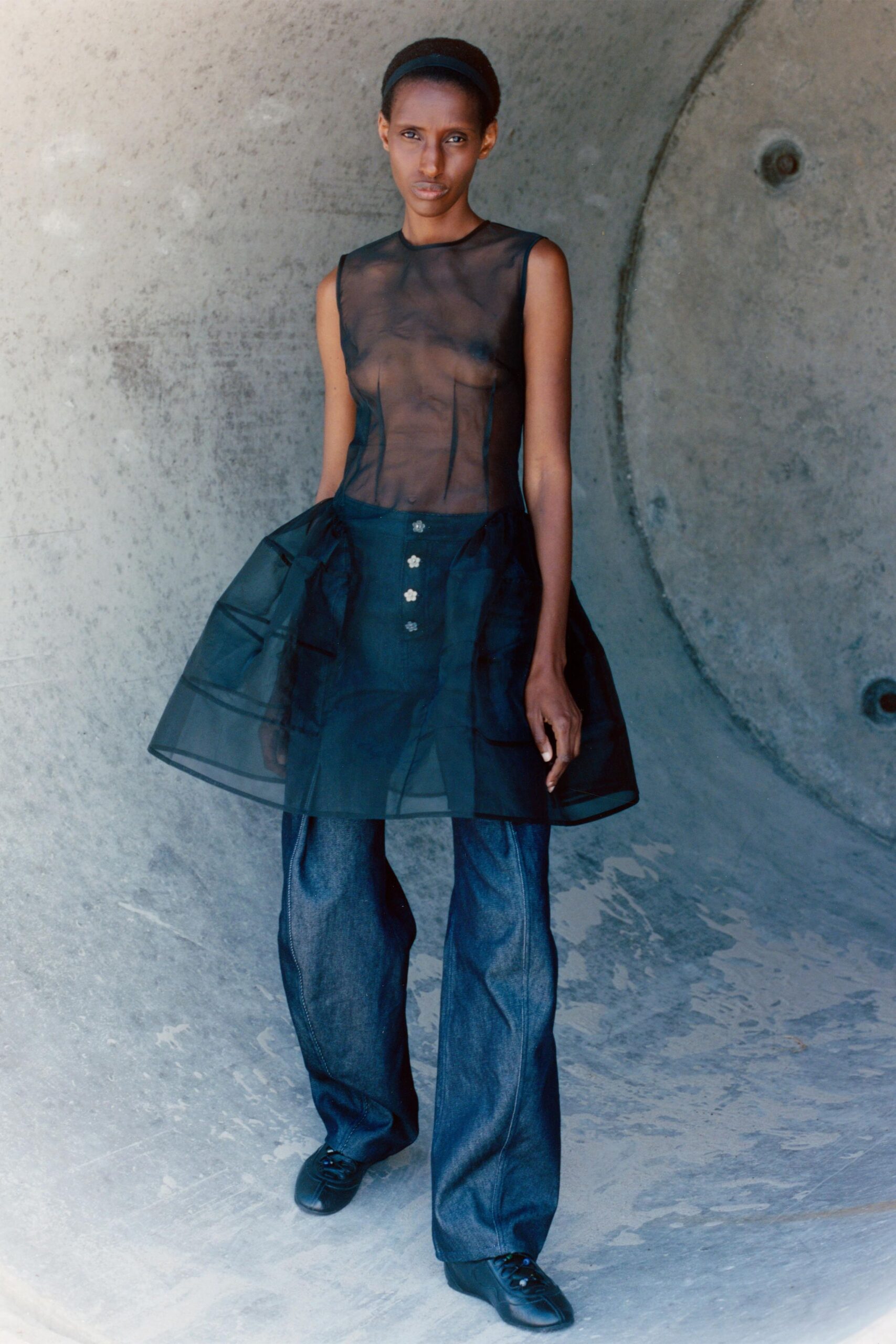 sheer black top with blue jeans