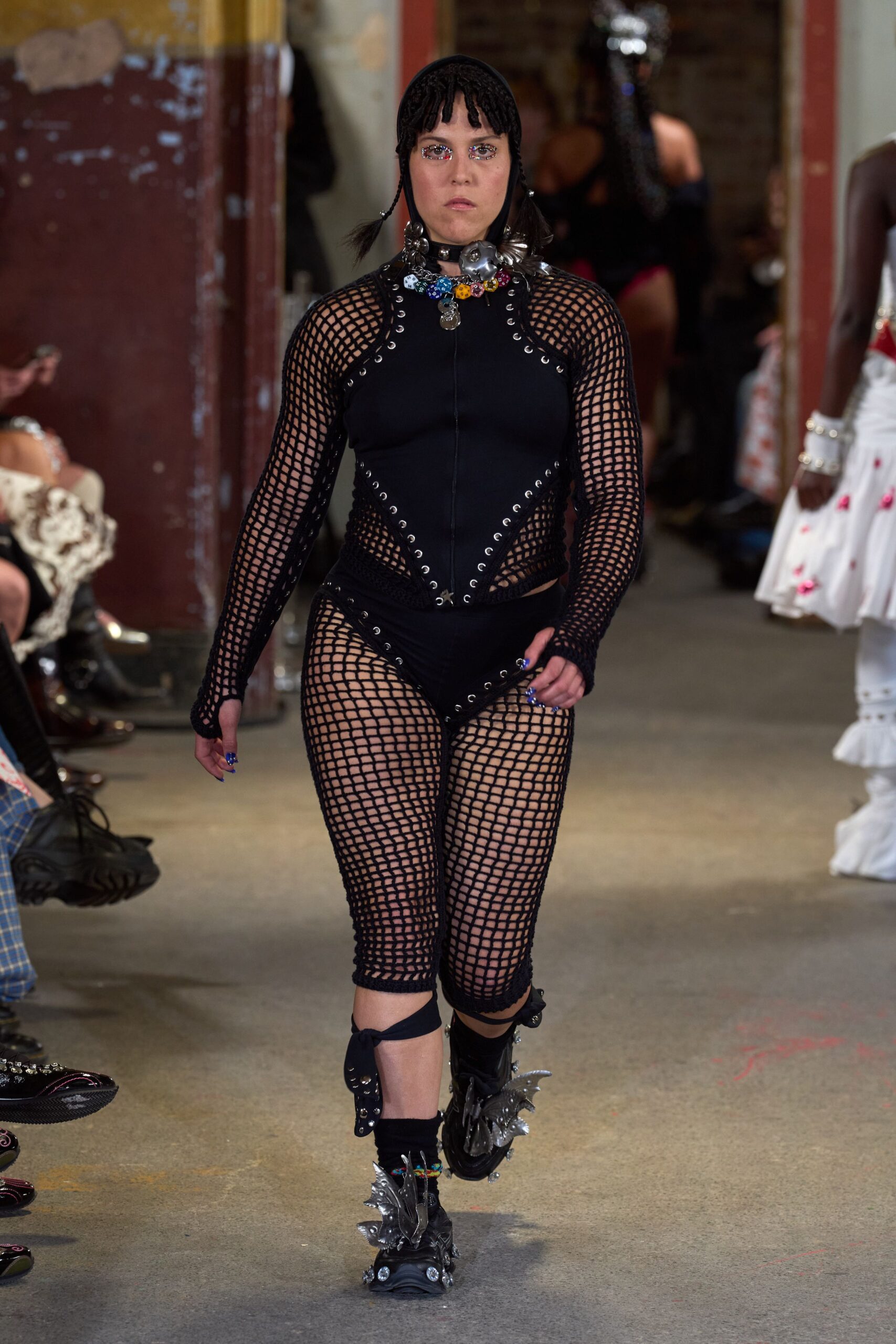 black mesh sleeveless high-neck fitted zippered catsuit