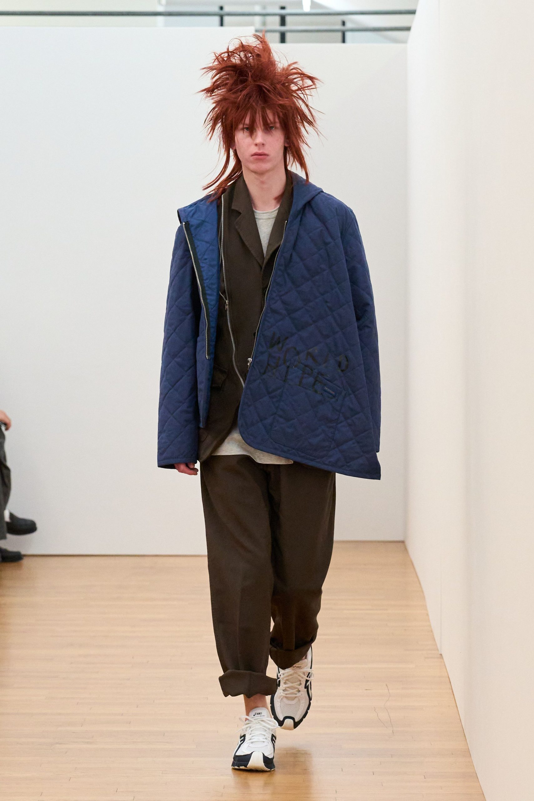 blue quilted jacket with gray shirt