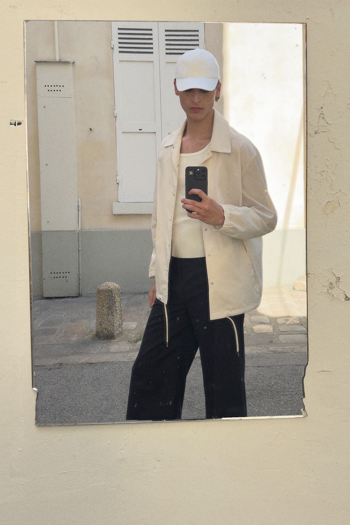 white jacket black pants outfit