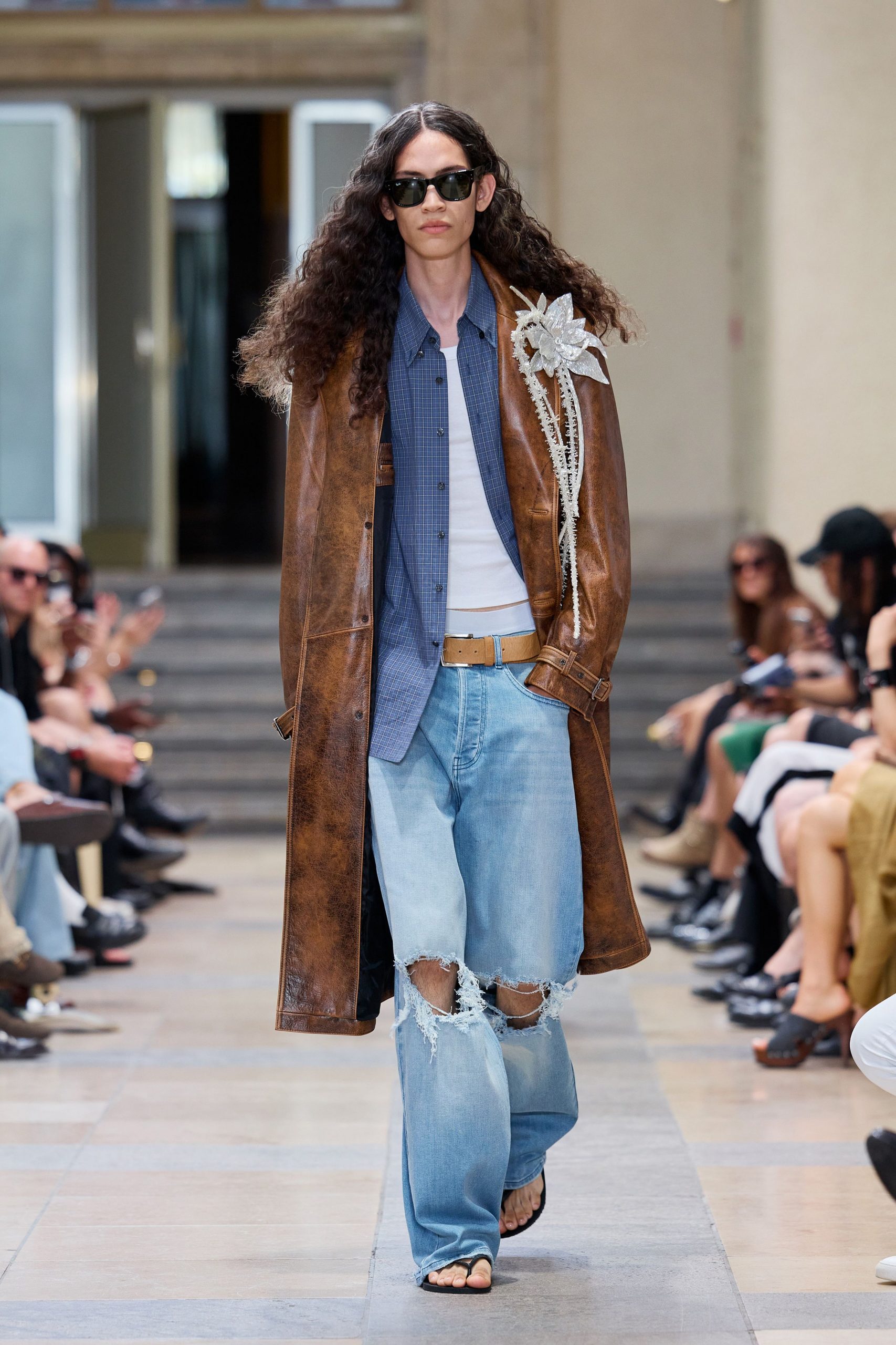 brown leather coat with blue shirt