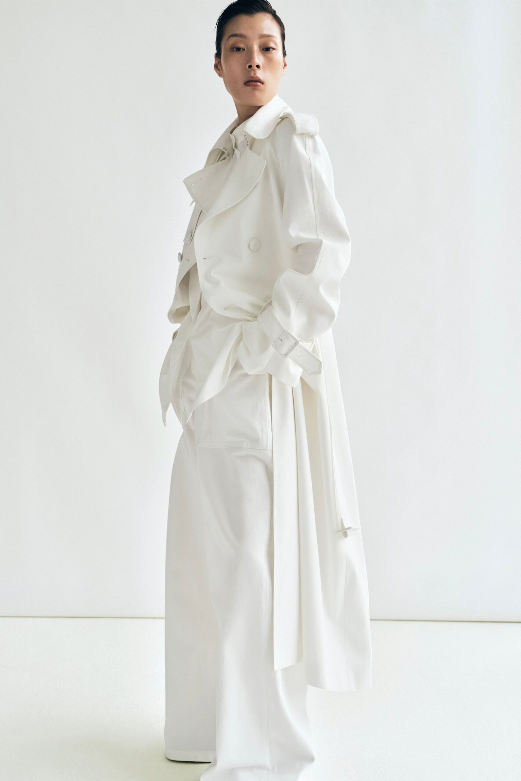 white cotton long-sleeve collared relaxed belted trench
