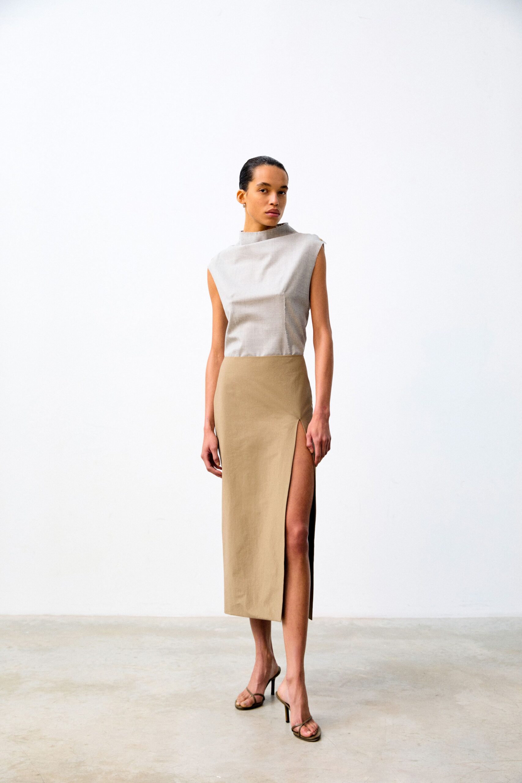 gray sleeveless top beige midi skirt