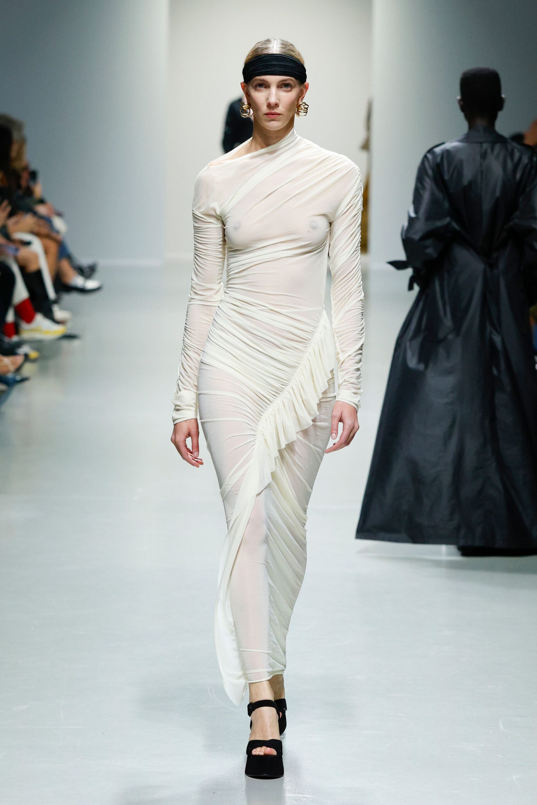 white sheer ruched gown with black shoes
