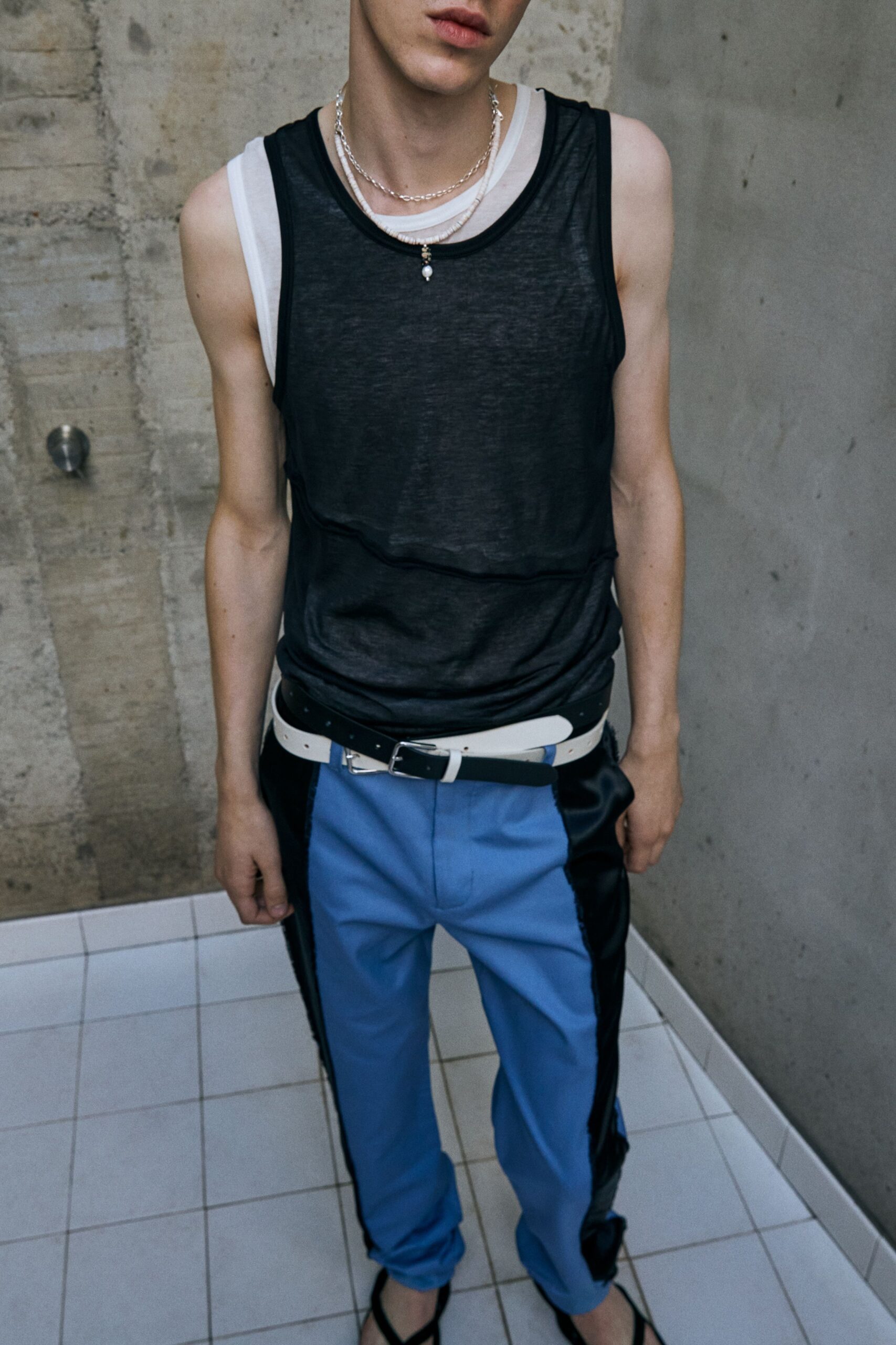 black tank-top blue pants