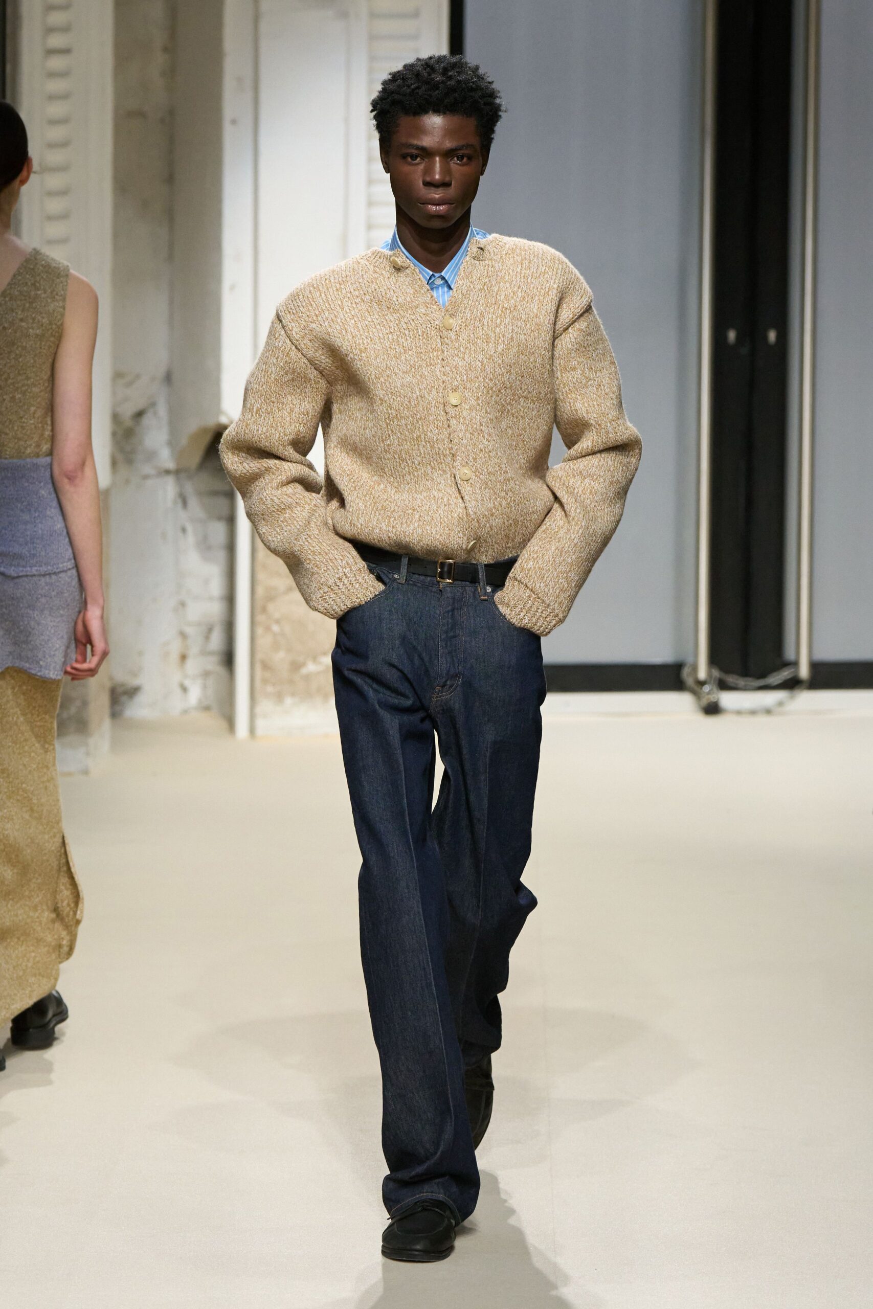 beige wool relaxed sweater with blue denim pants
