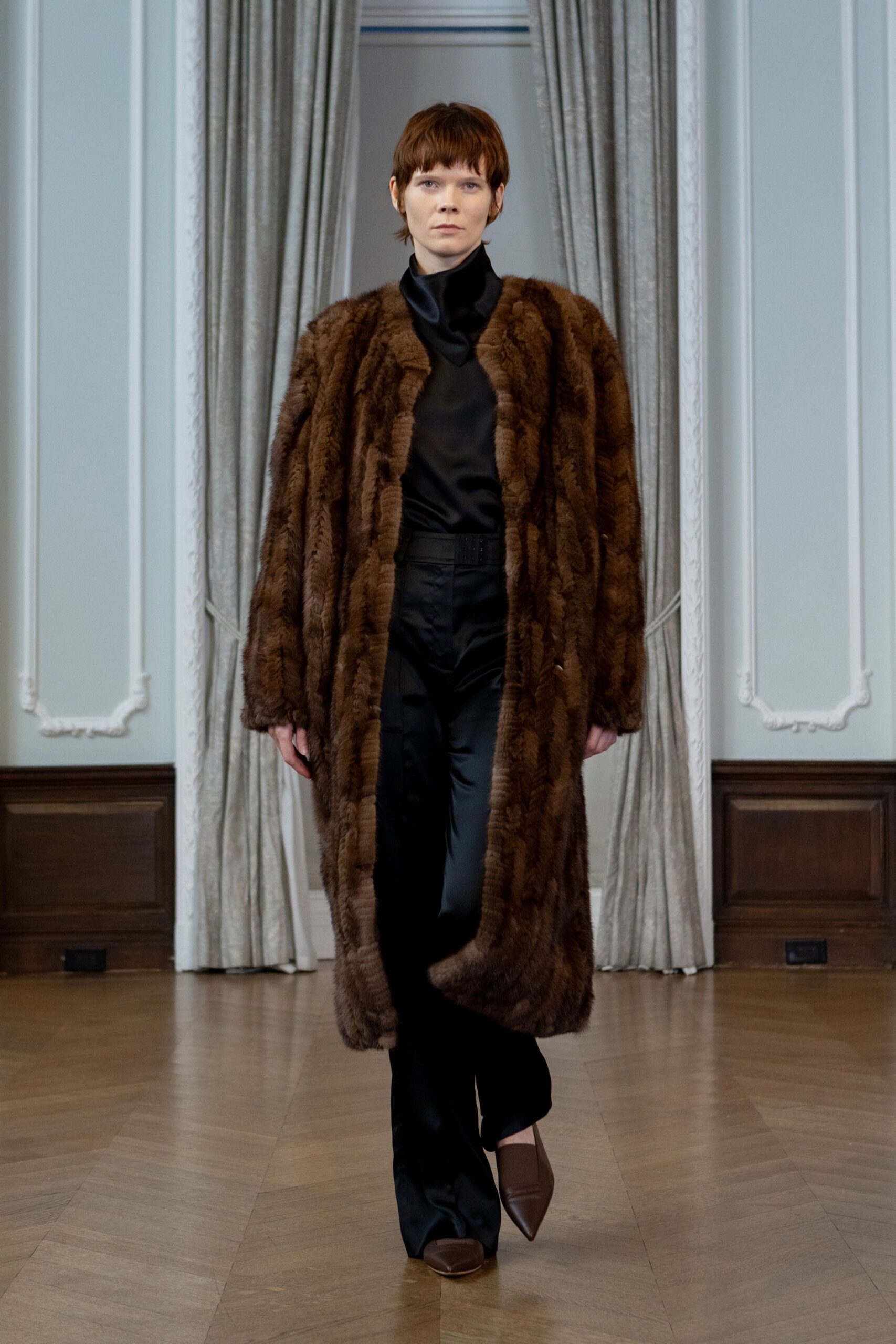 brown fur coat with black top
