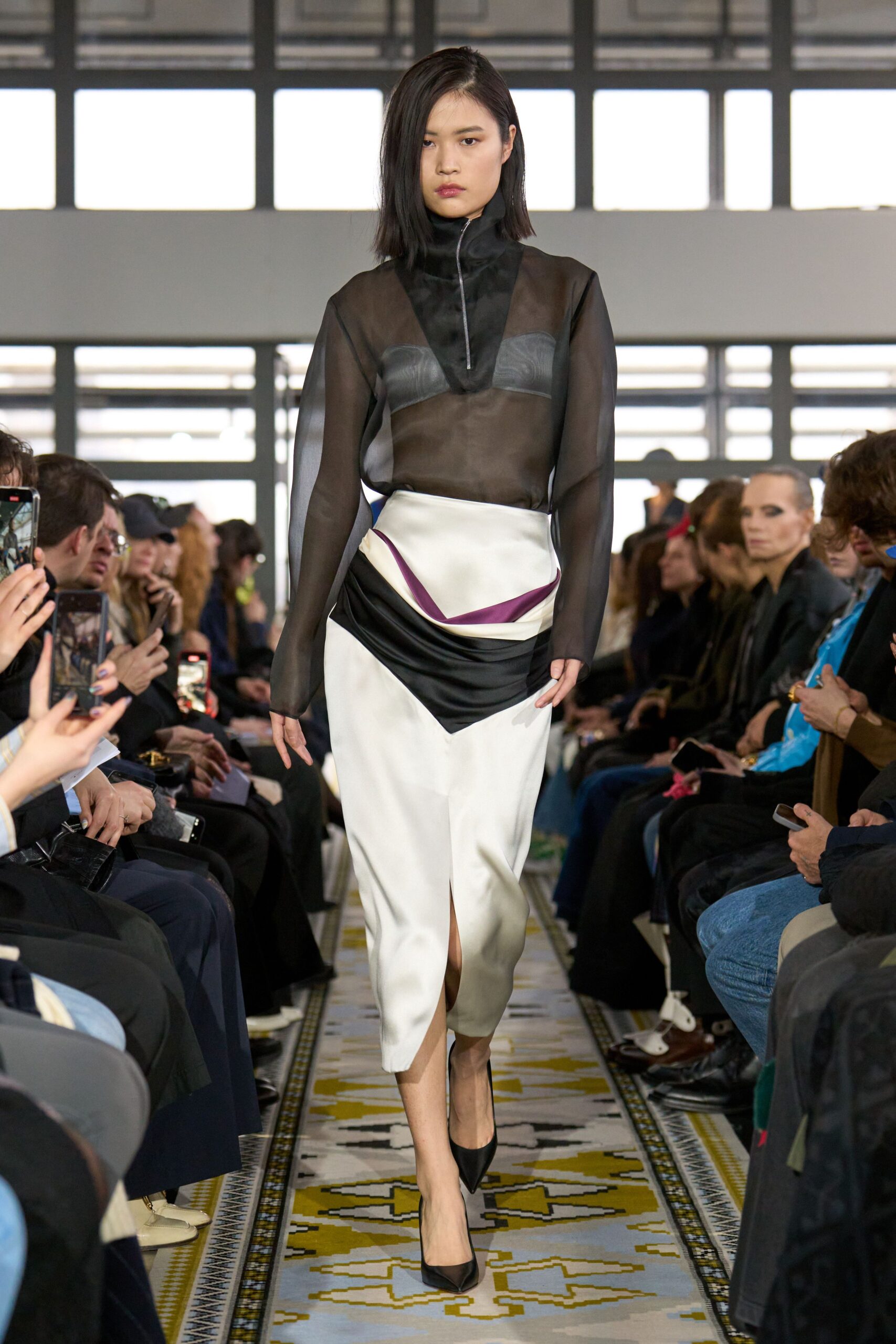 black sheer top and asymmetric skirt