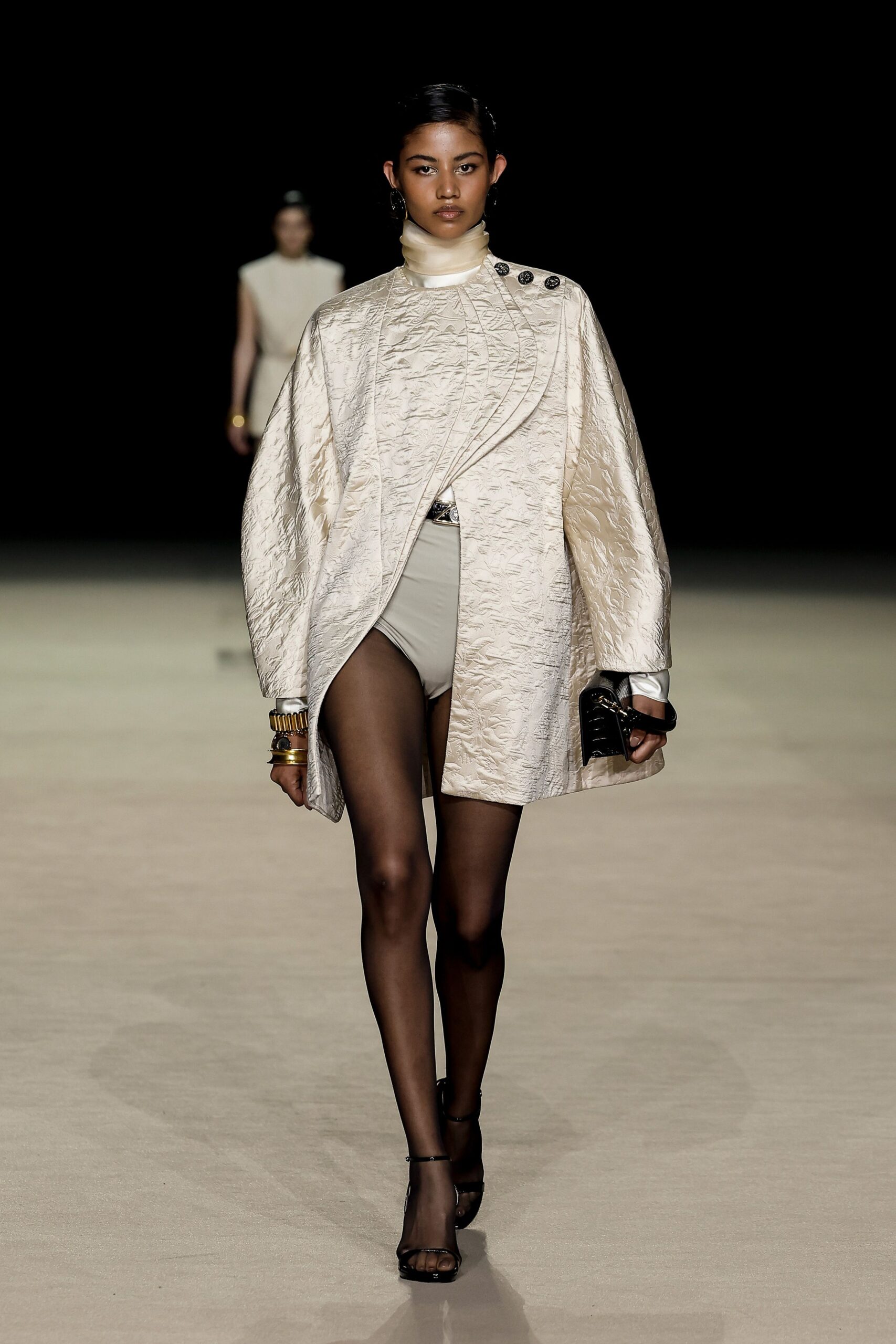 ivory silk coat with beige shorts