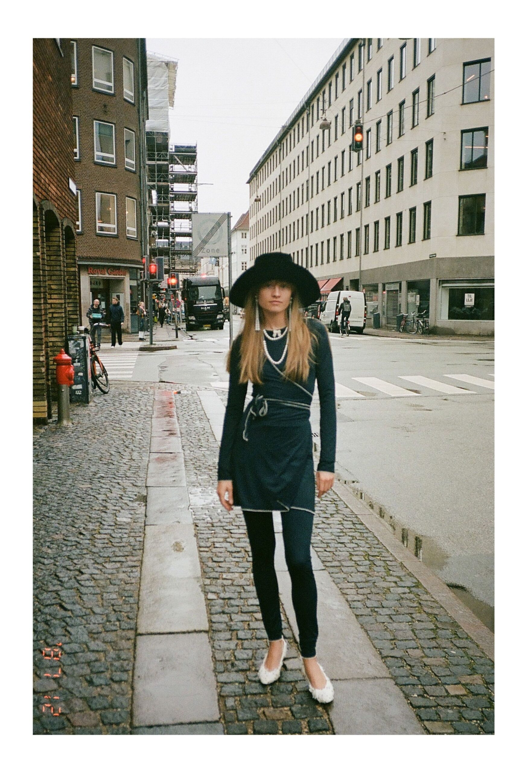 black fitted mini dress with hat