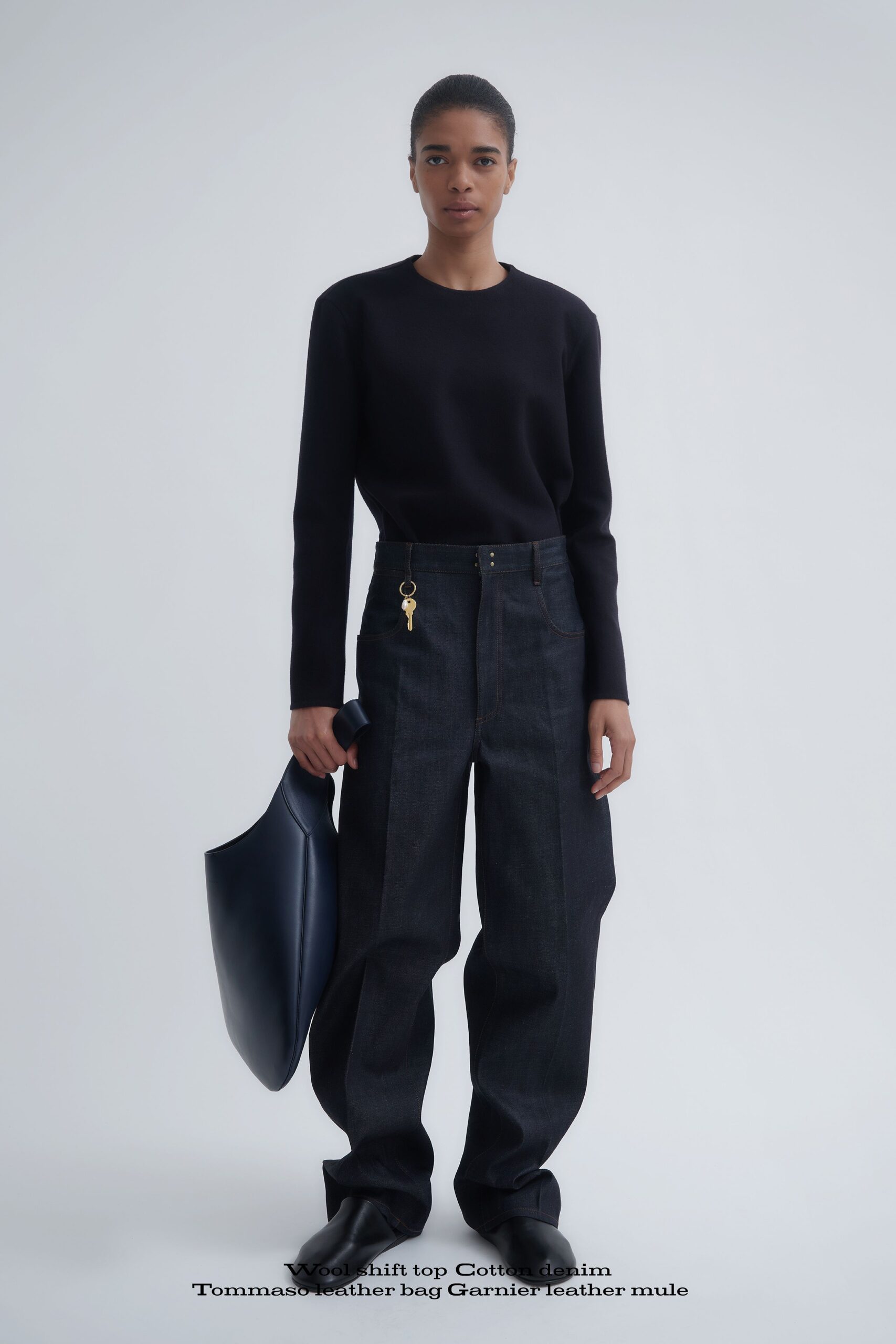 black cotton top with relaxed denim pants