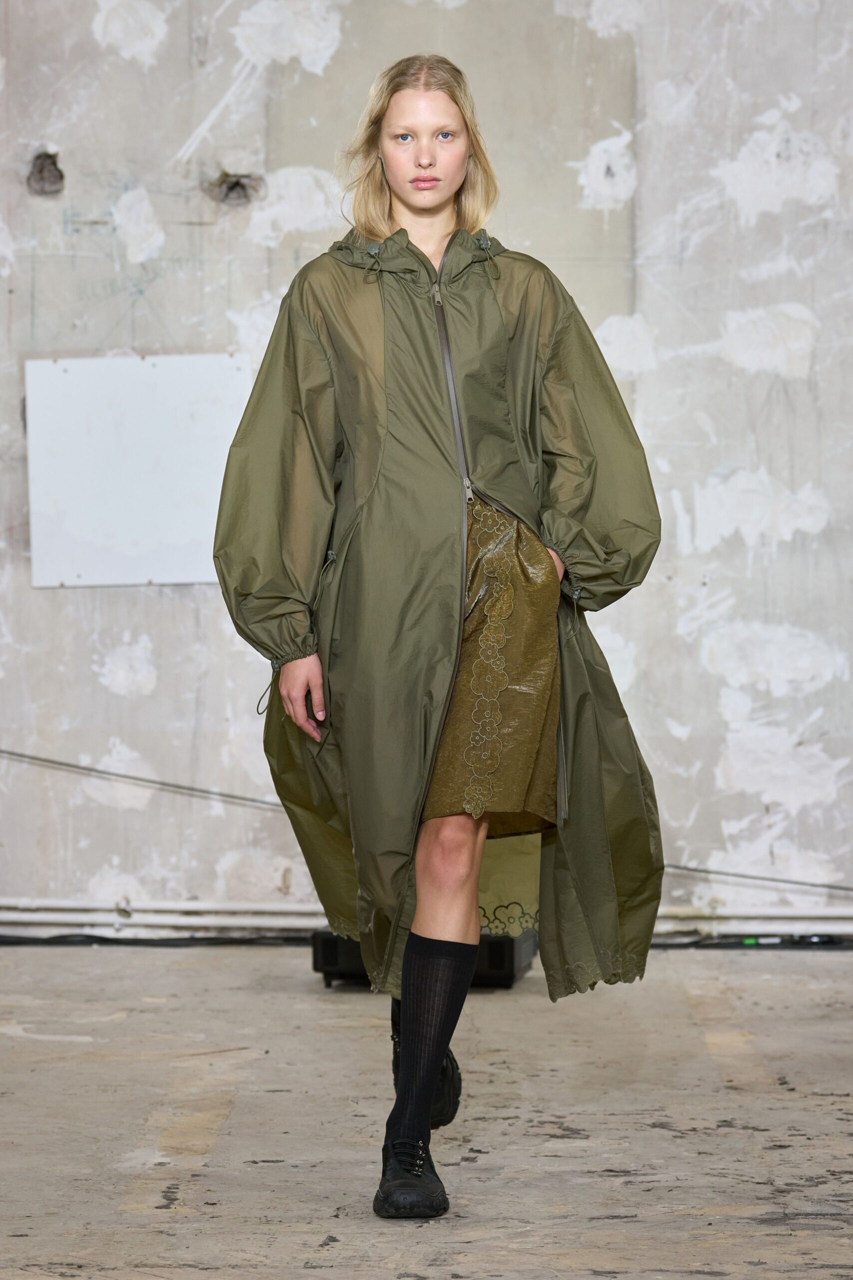 oversized green coat with gold skirt
