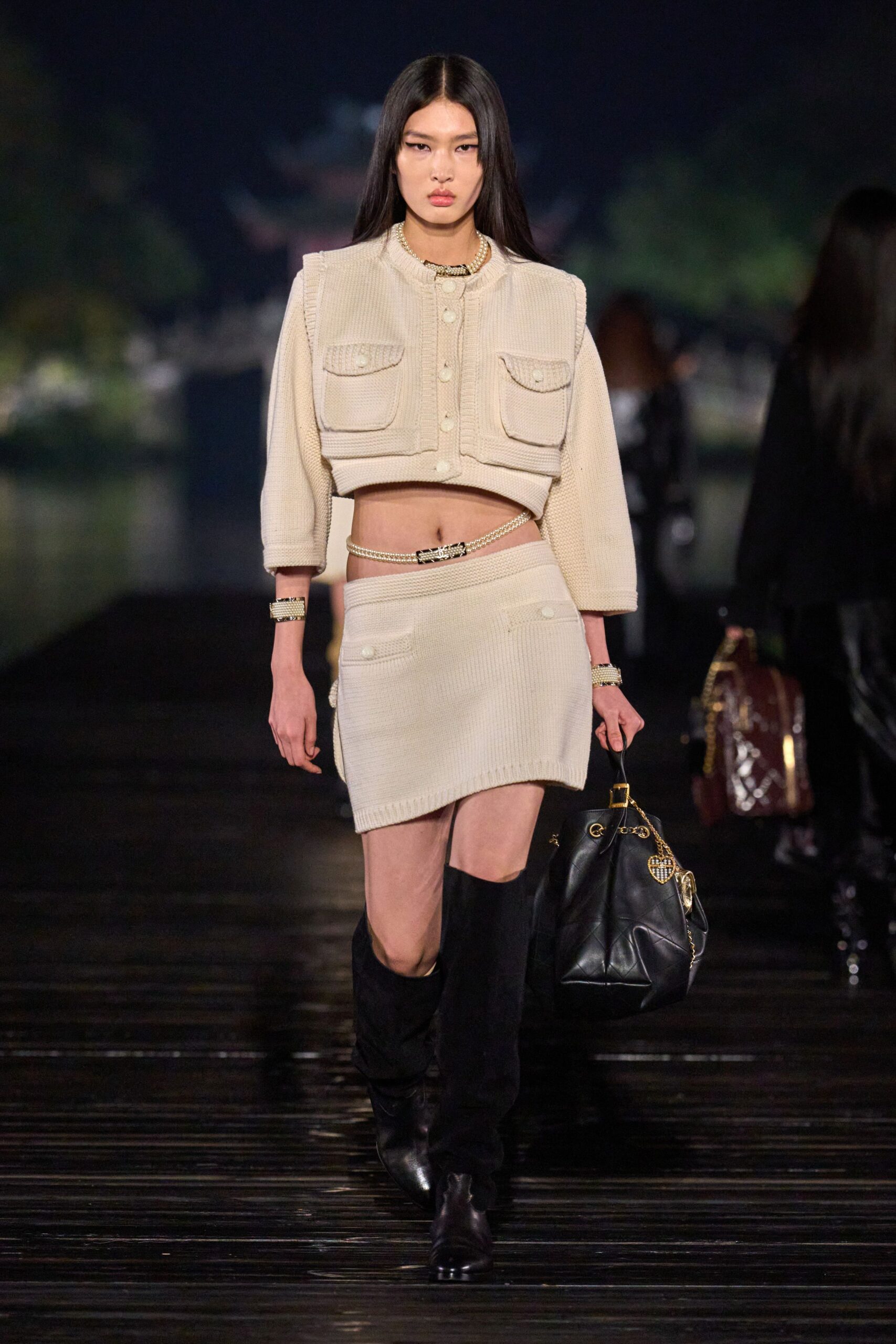 beige fitted jacket and mini skirt
