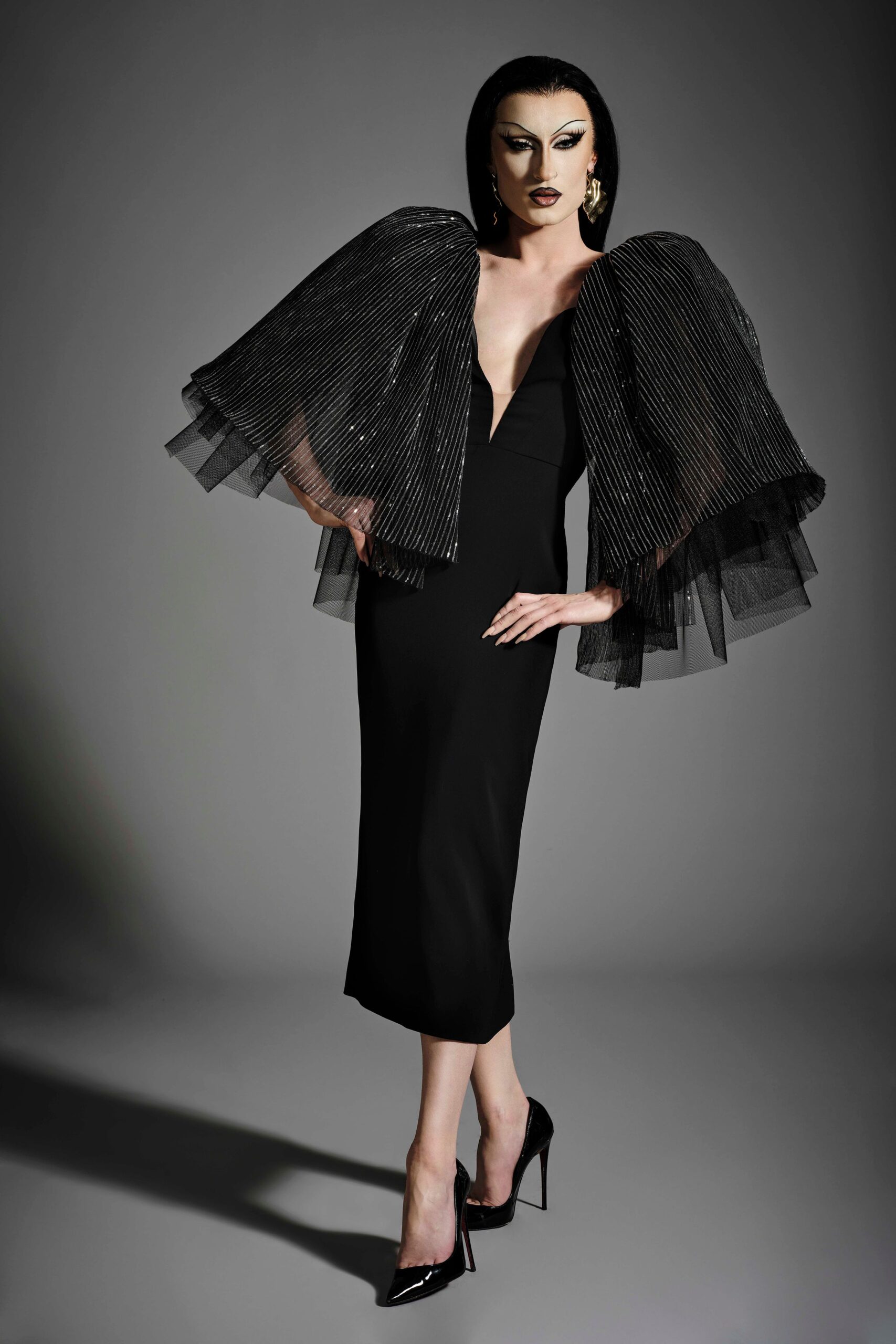 black fitted midi dress with cape