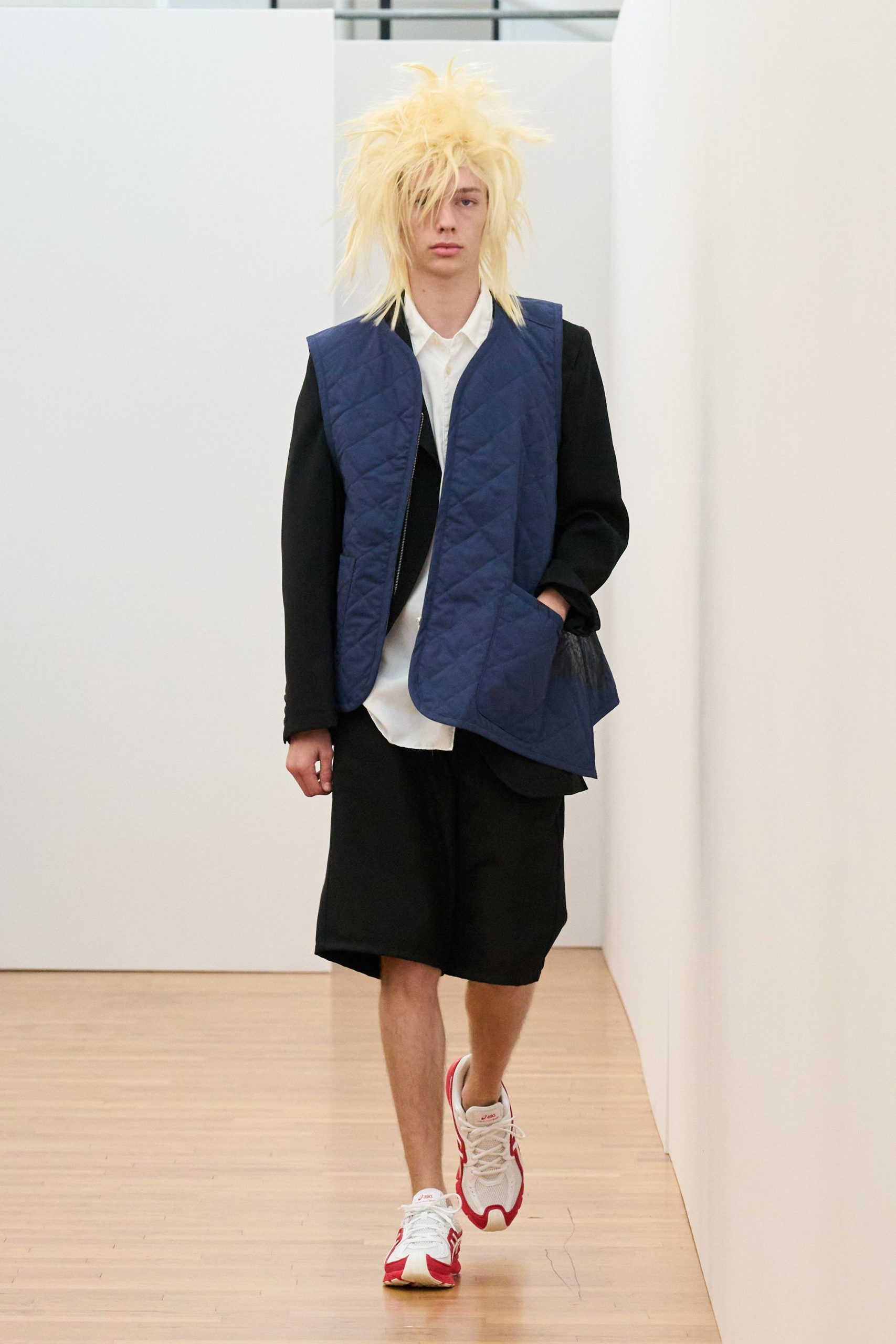 blue quilted vest with black blazer