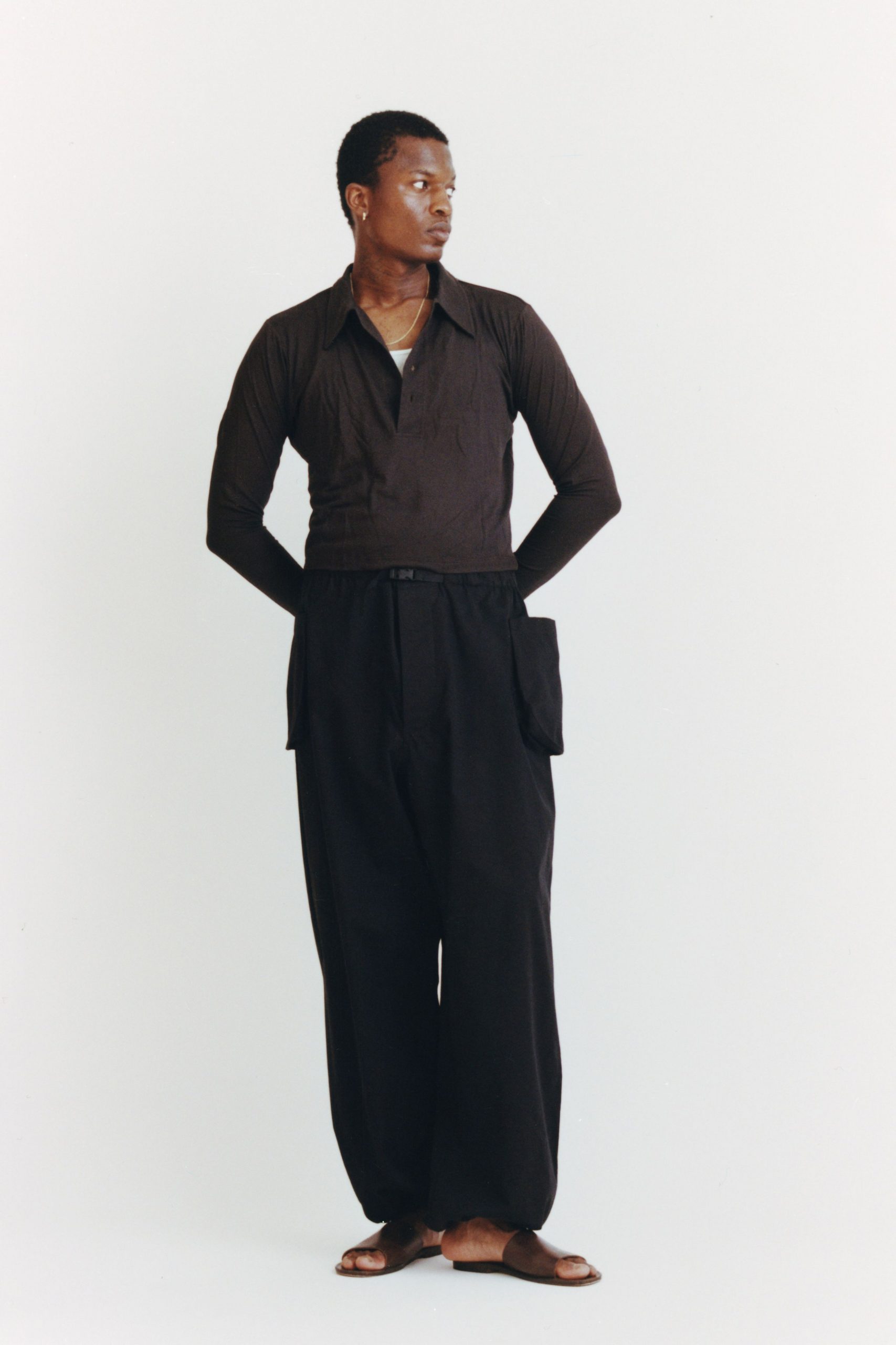 brown fitted shirt black relaxed pants