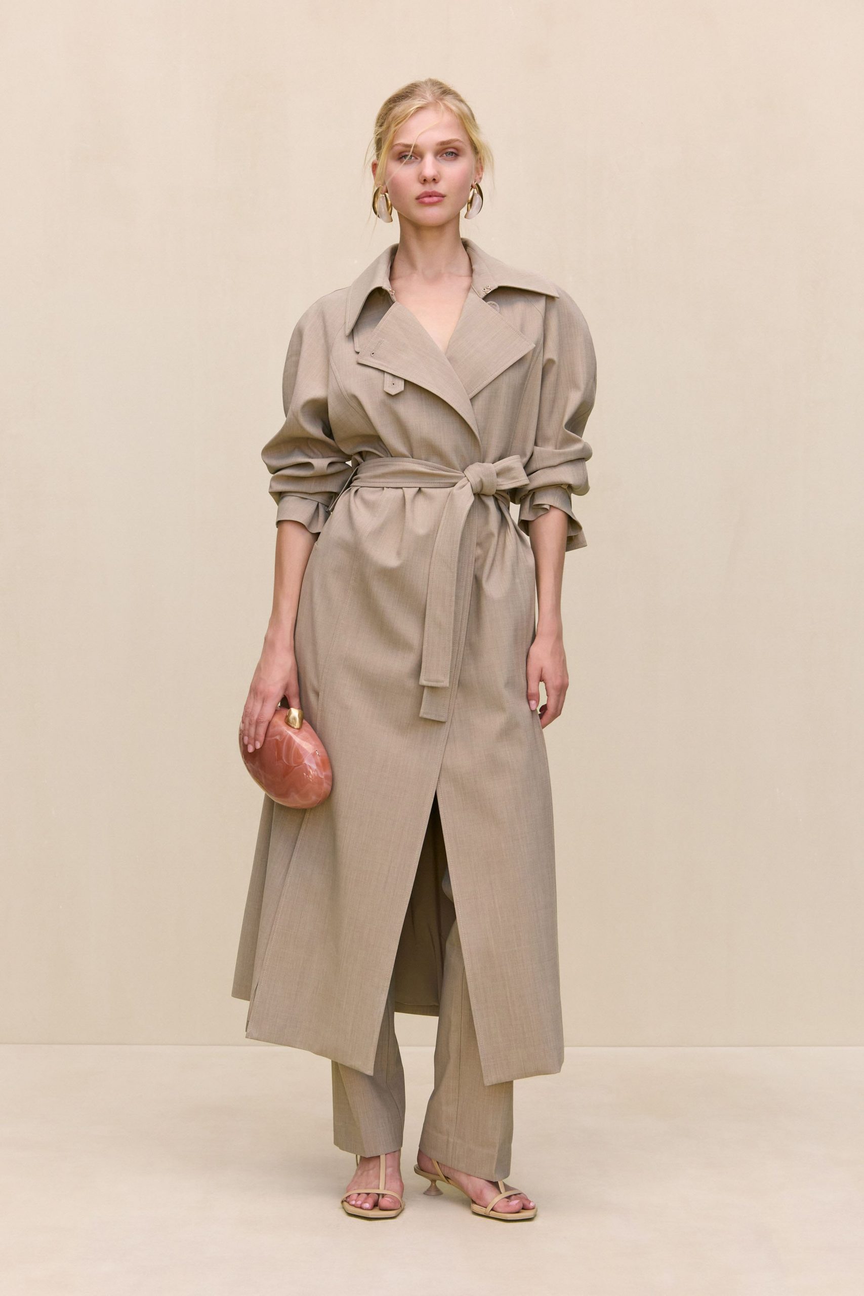 beige trench coat with tailored pants