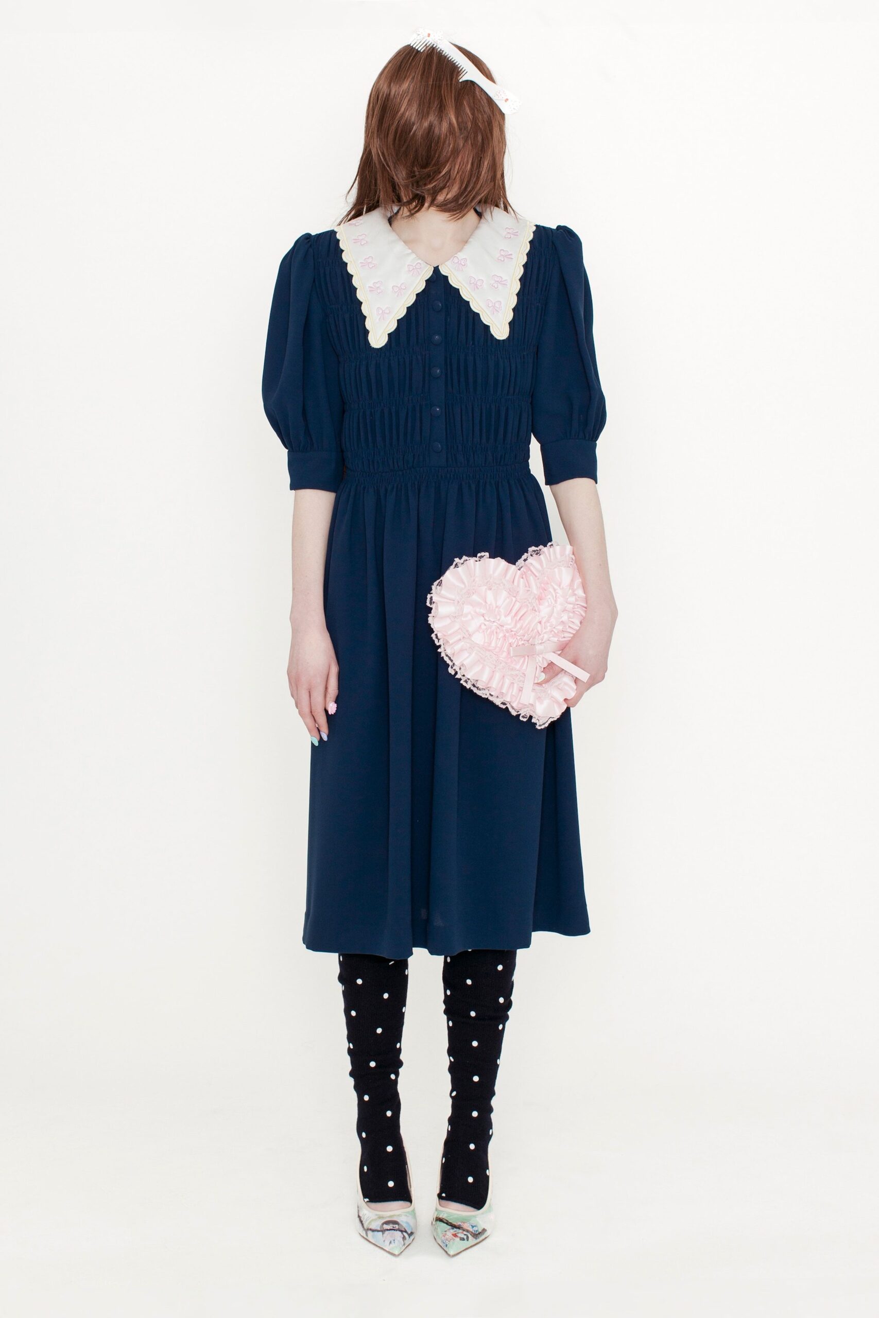 navy pleated midi dress with heart bag