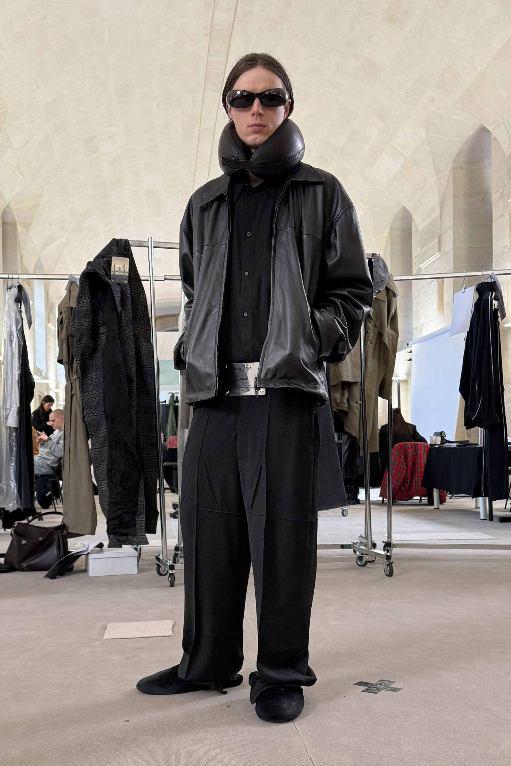 black leather jacket with wide-leg pants