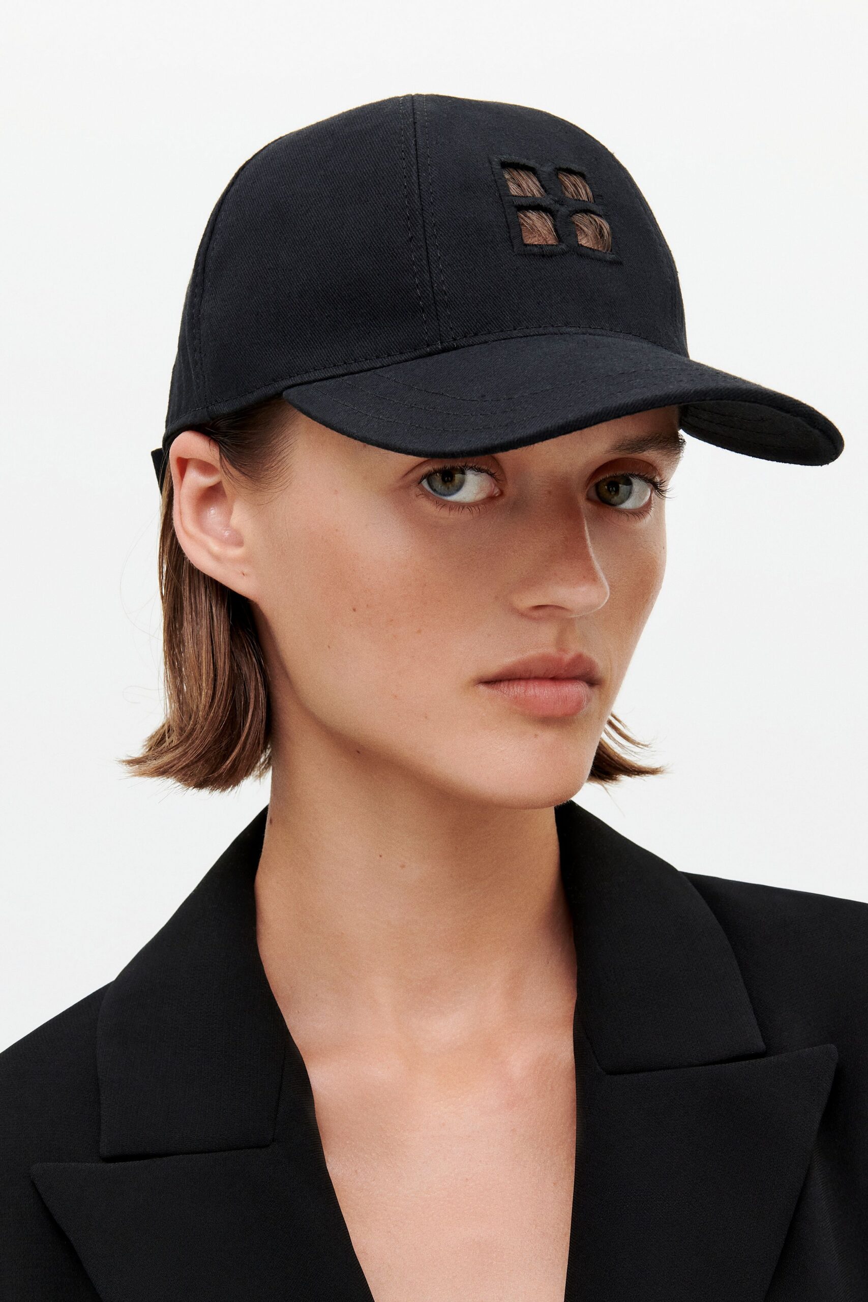 black blazer and cap
