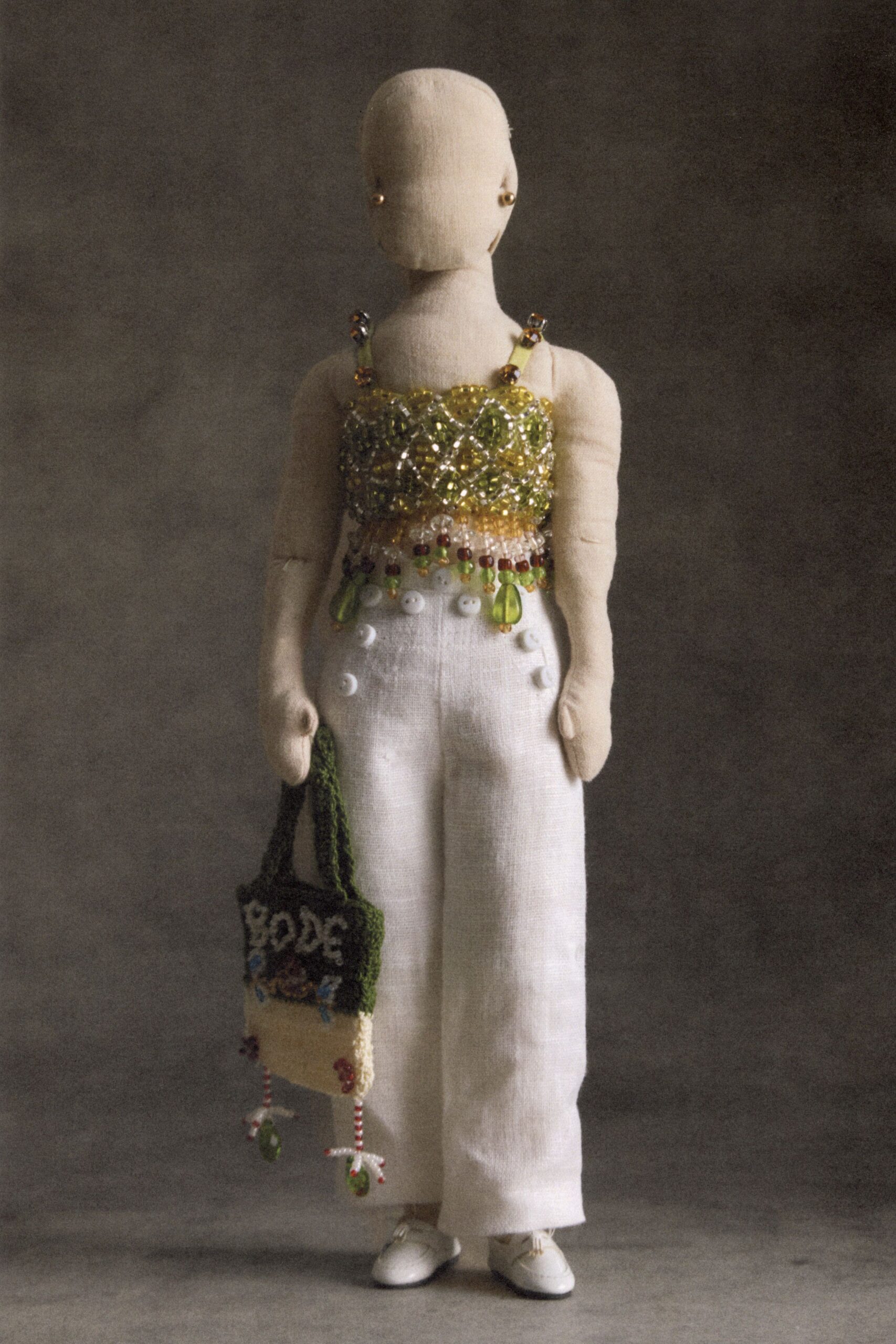 green knit sleeveless relaxed printed fringed textured bag