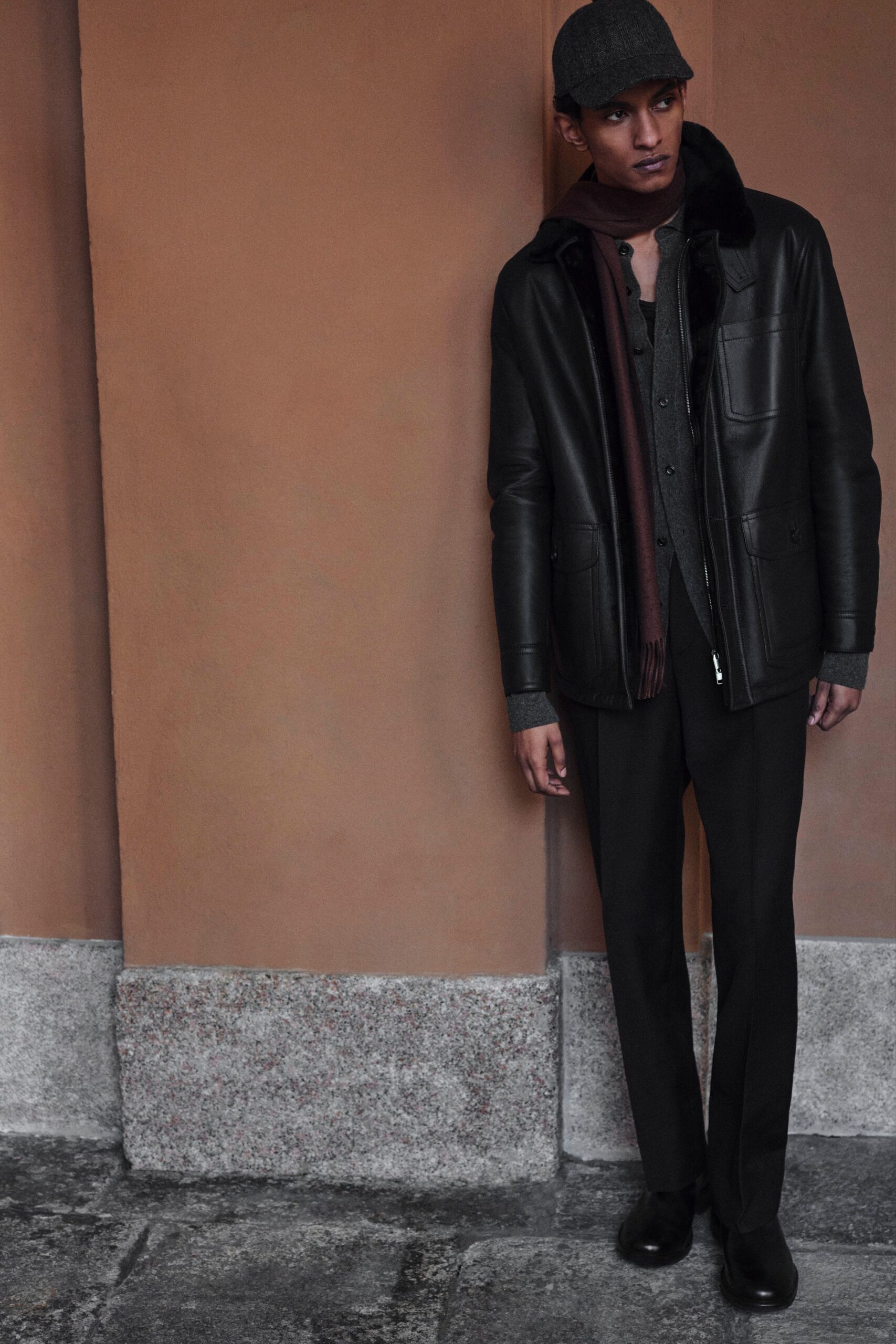 black leather jacket with gray shirt