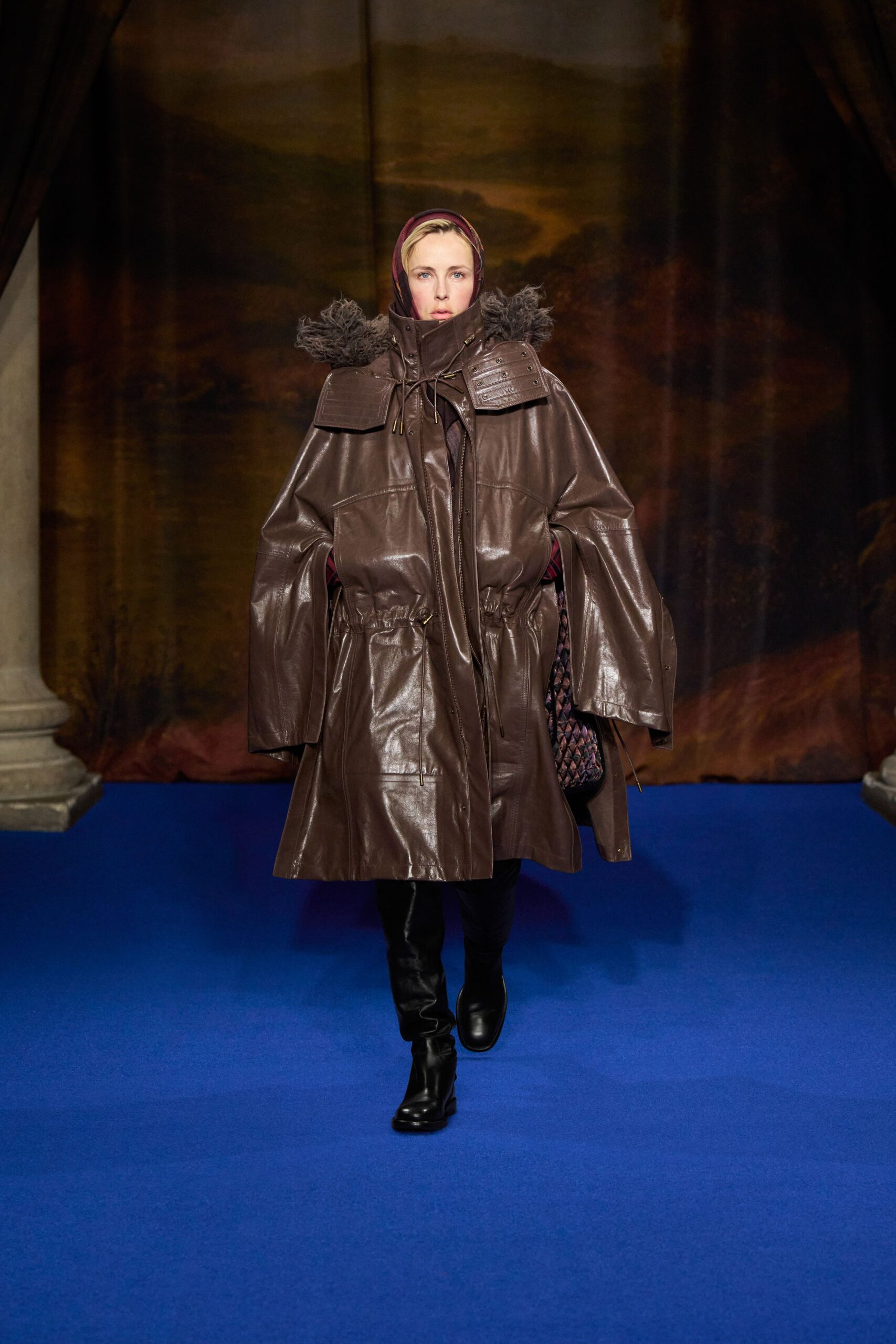 brown leather coat with black pants