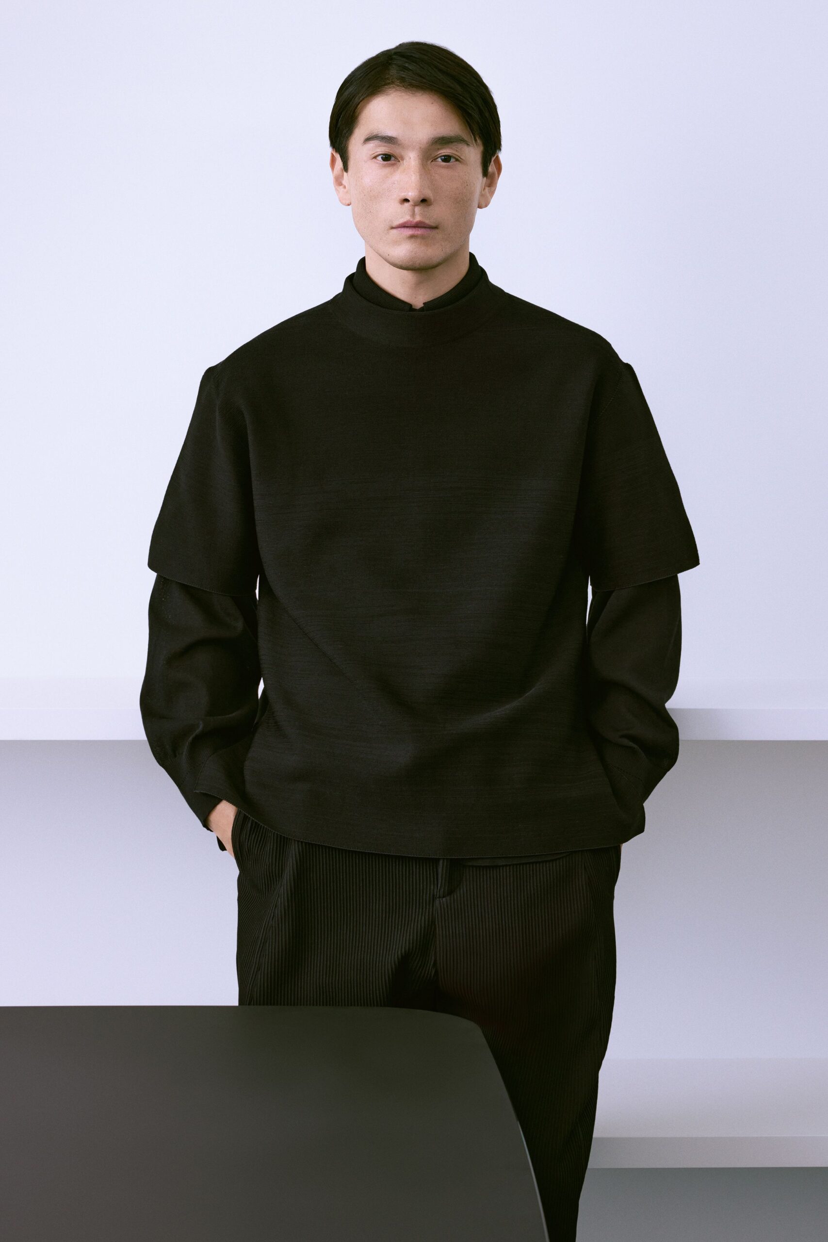 black relaxed top and tailored pants