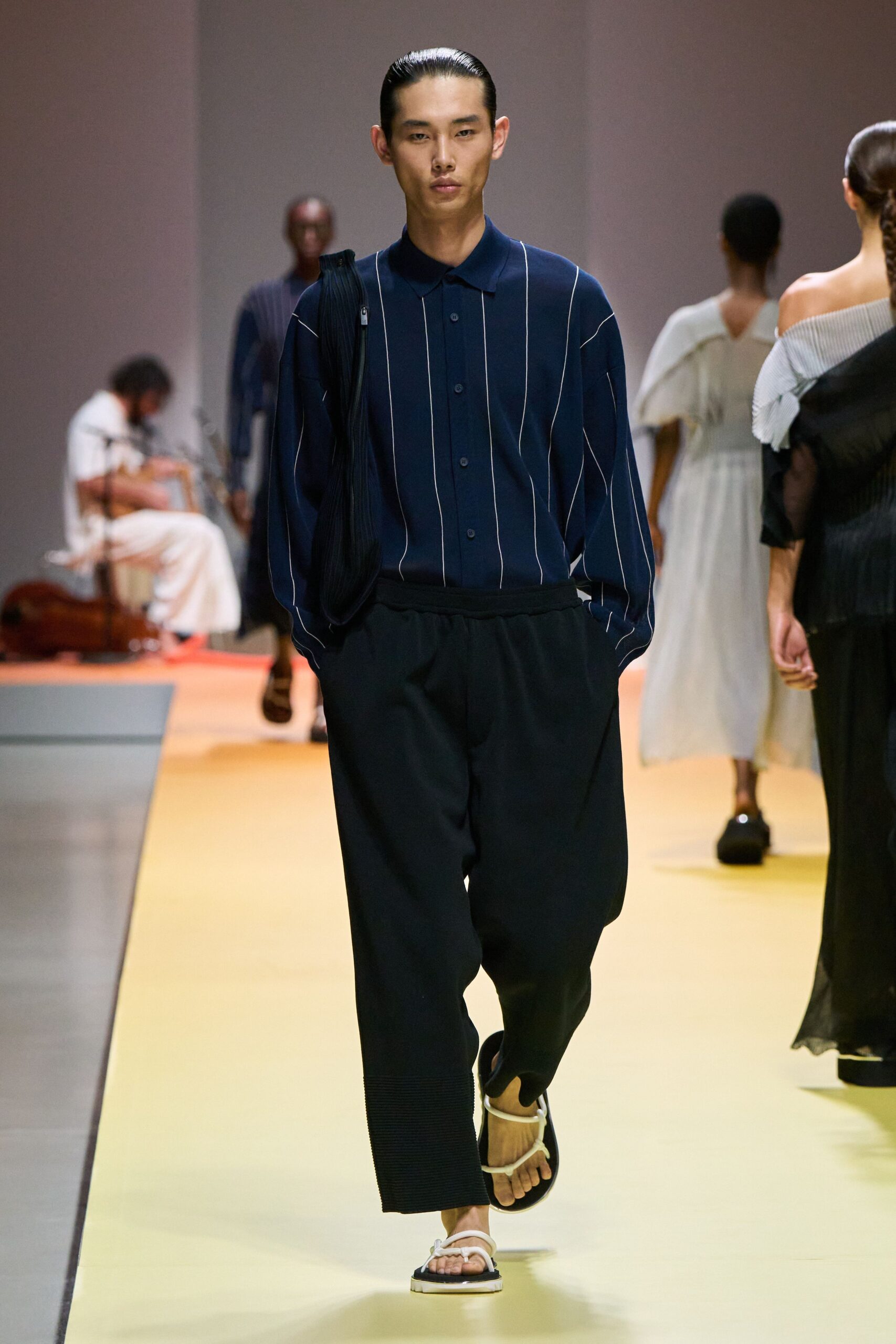 blue striped shirt black pants sandals