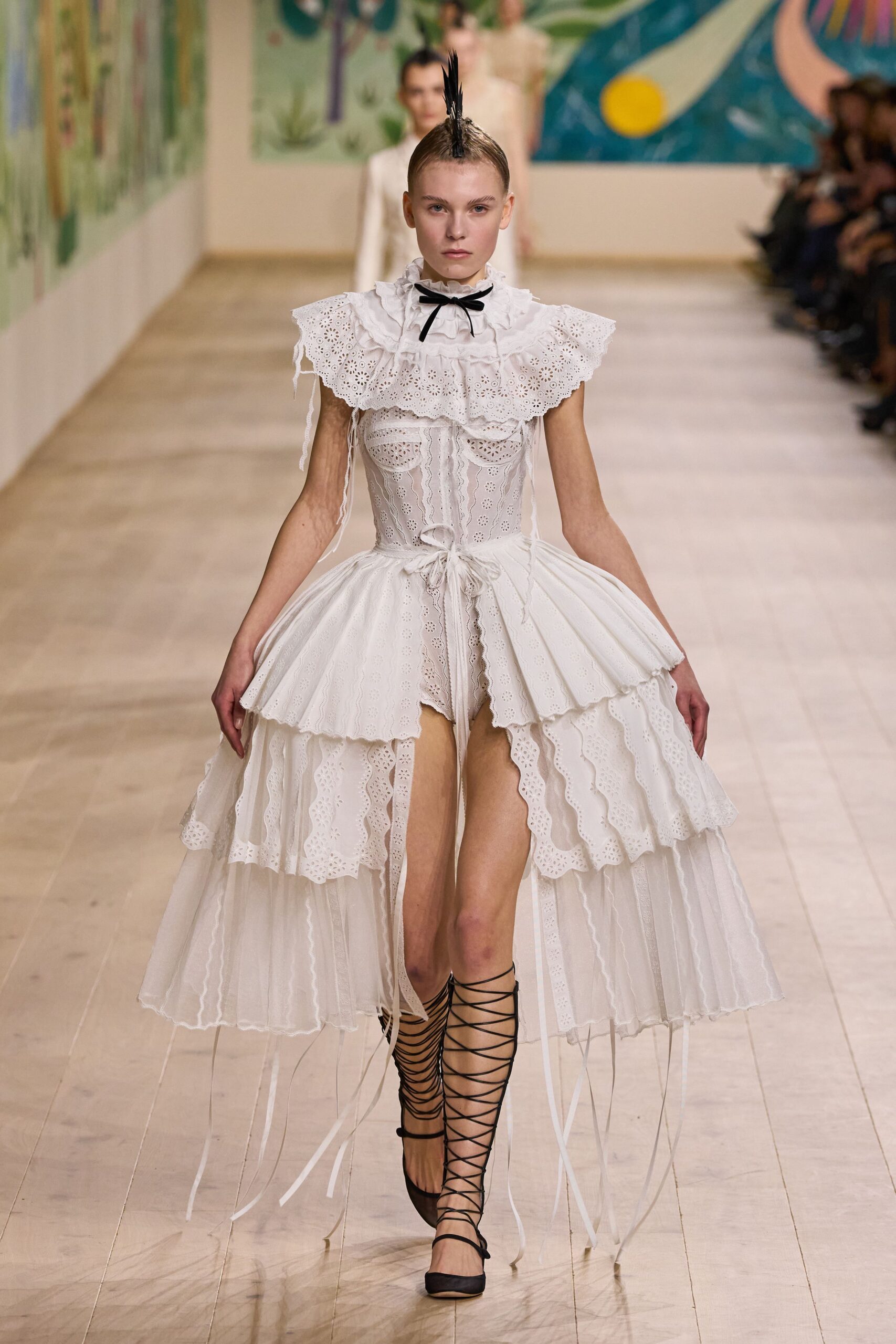 white layered ruffled dress with black shoes