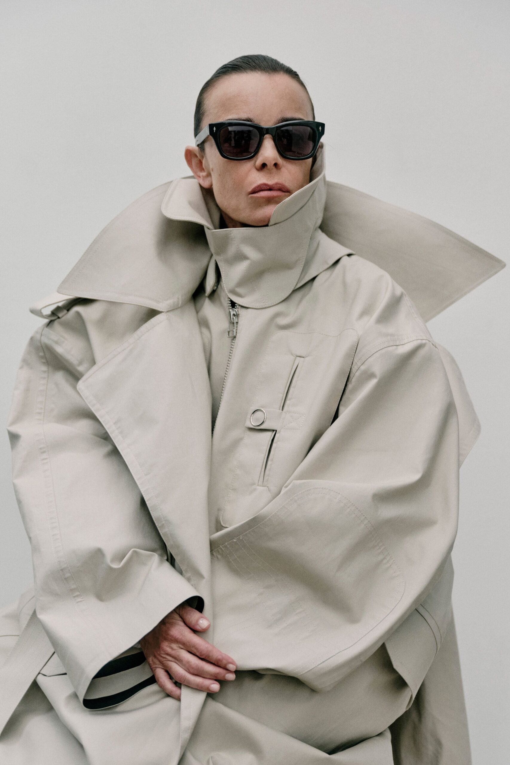 beige oversized coat with sunglasses