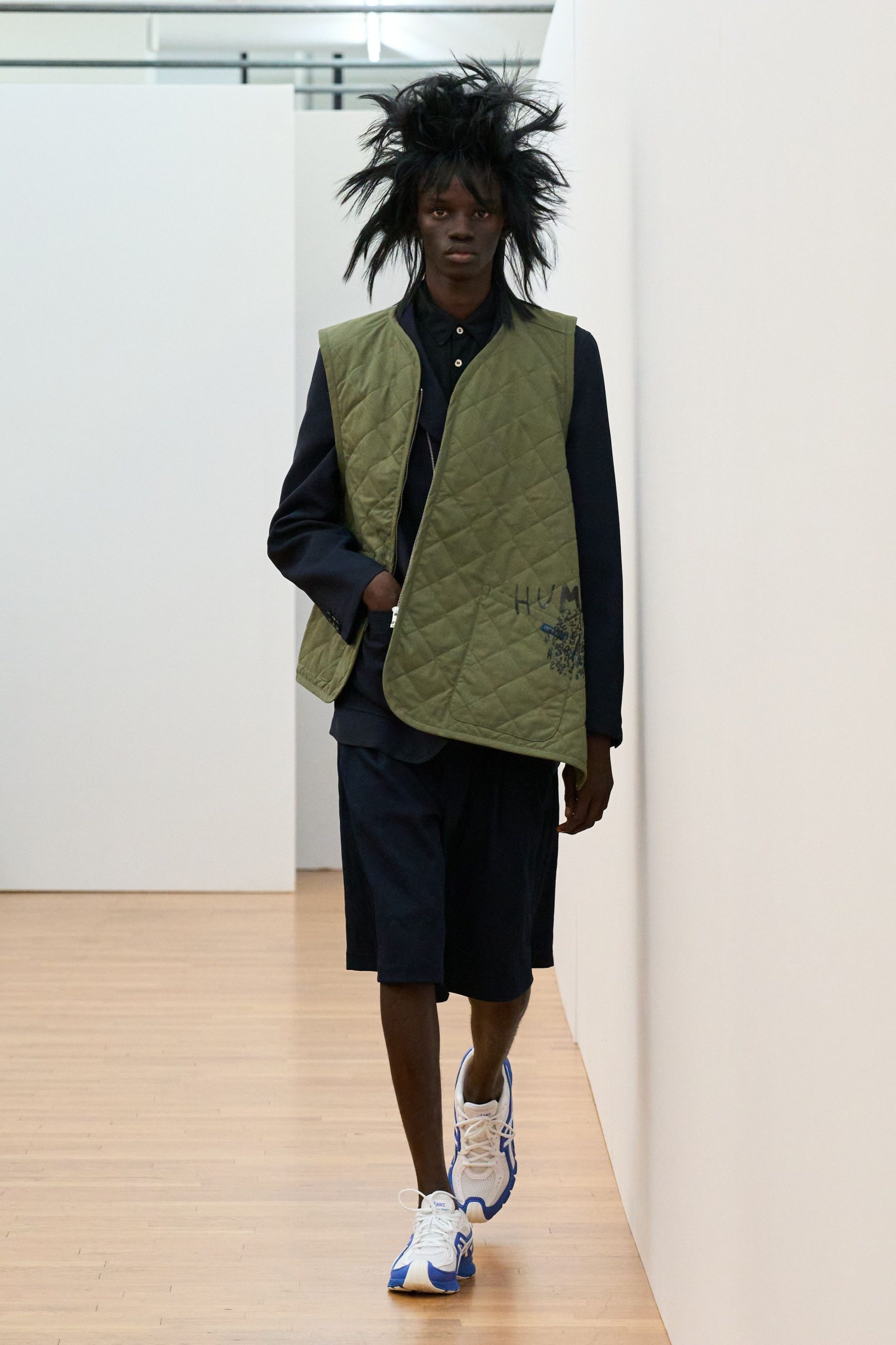 green quilted vest with black shirt