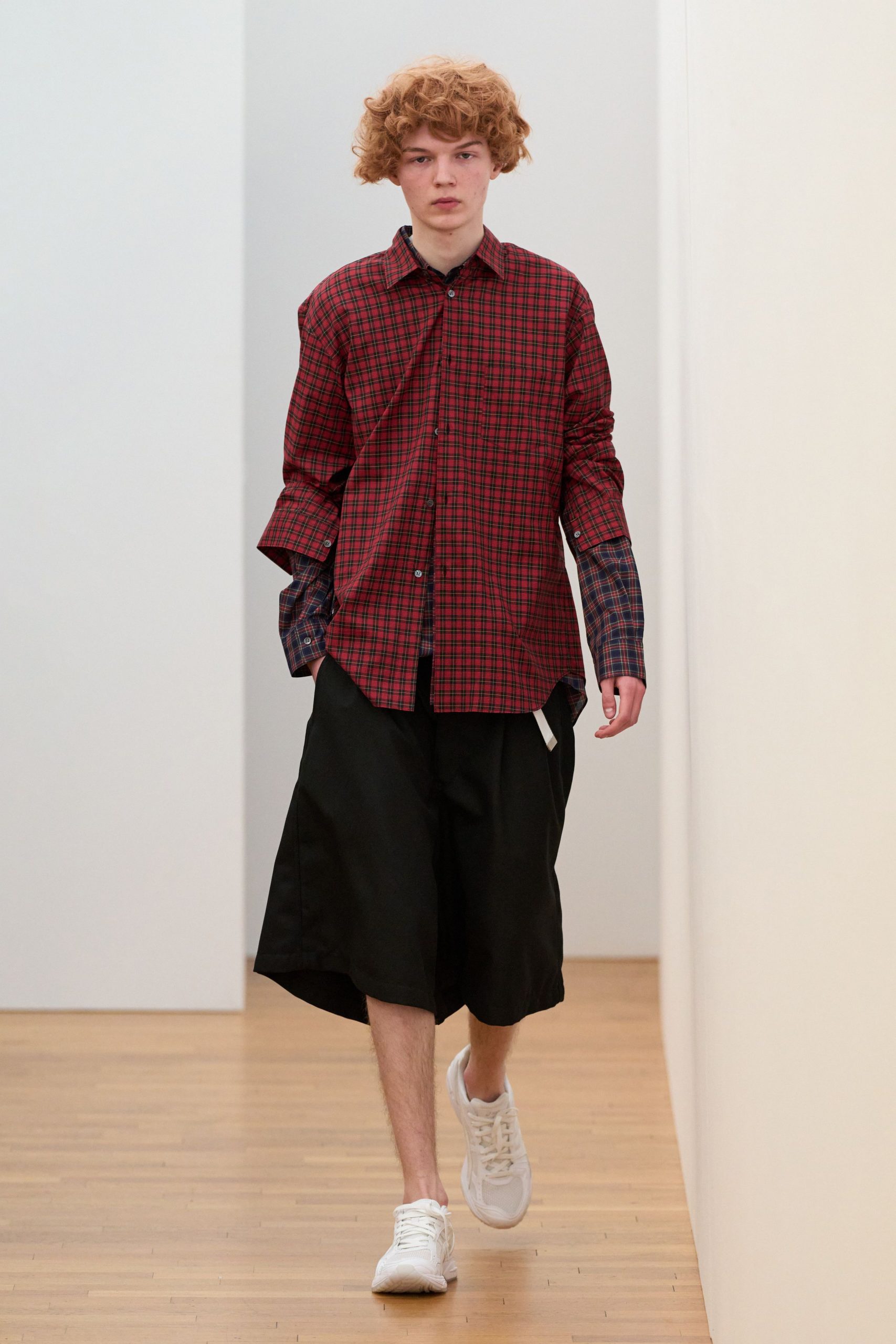 red checked shirt with black shorts