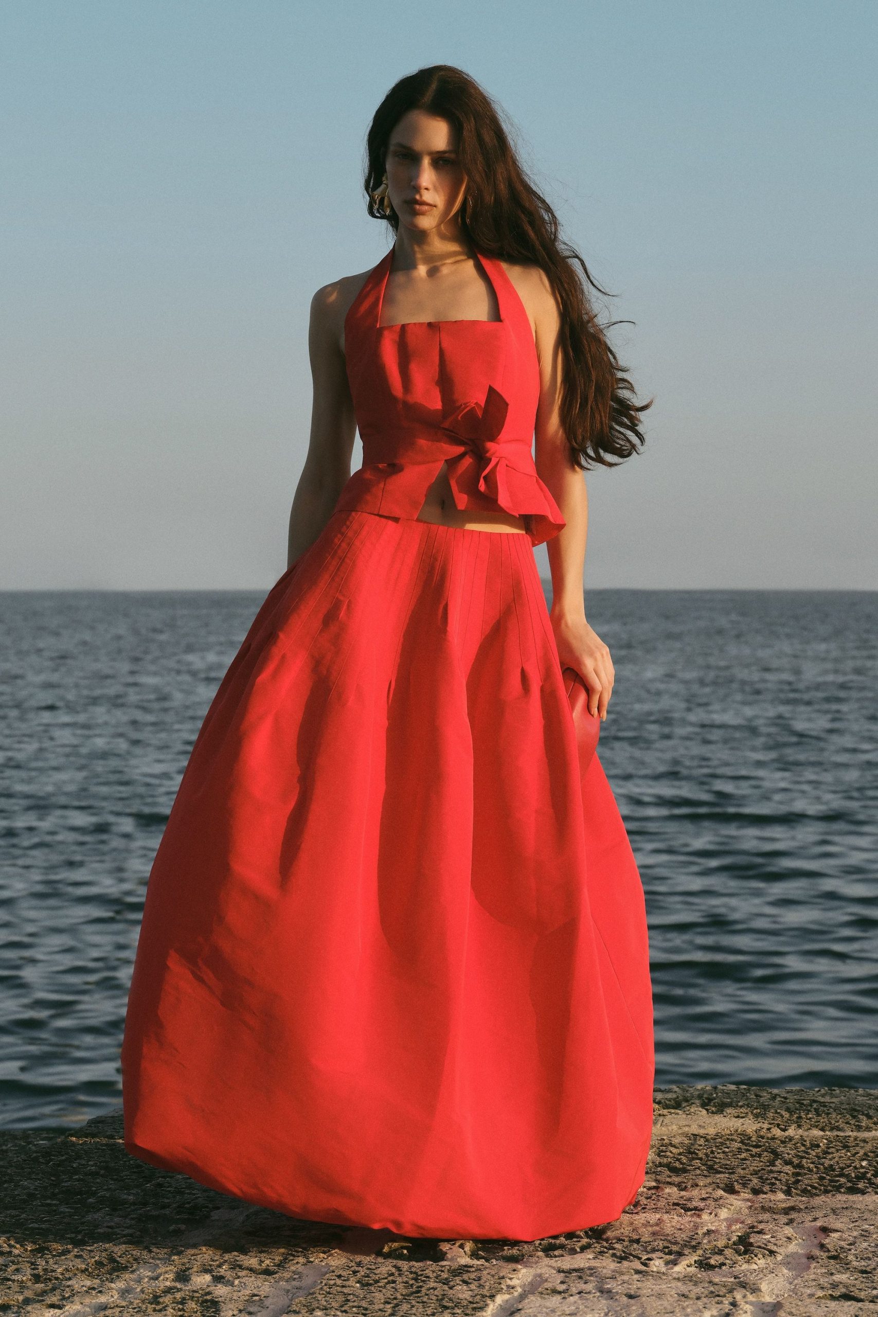 red pleated halter gown