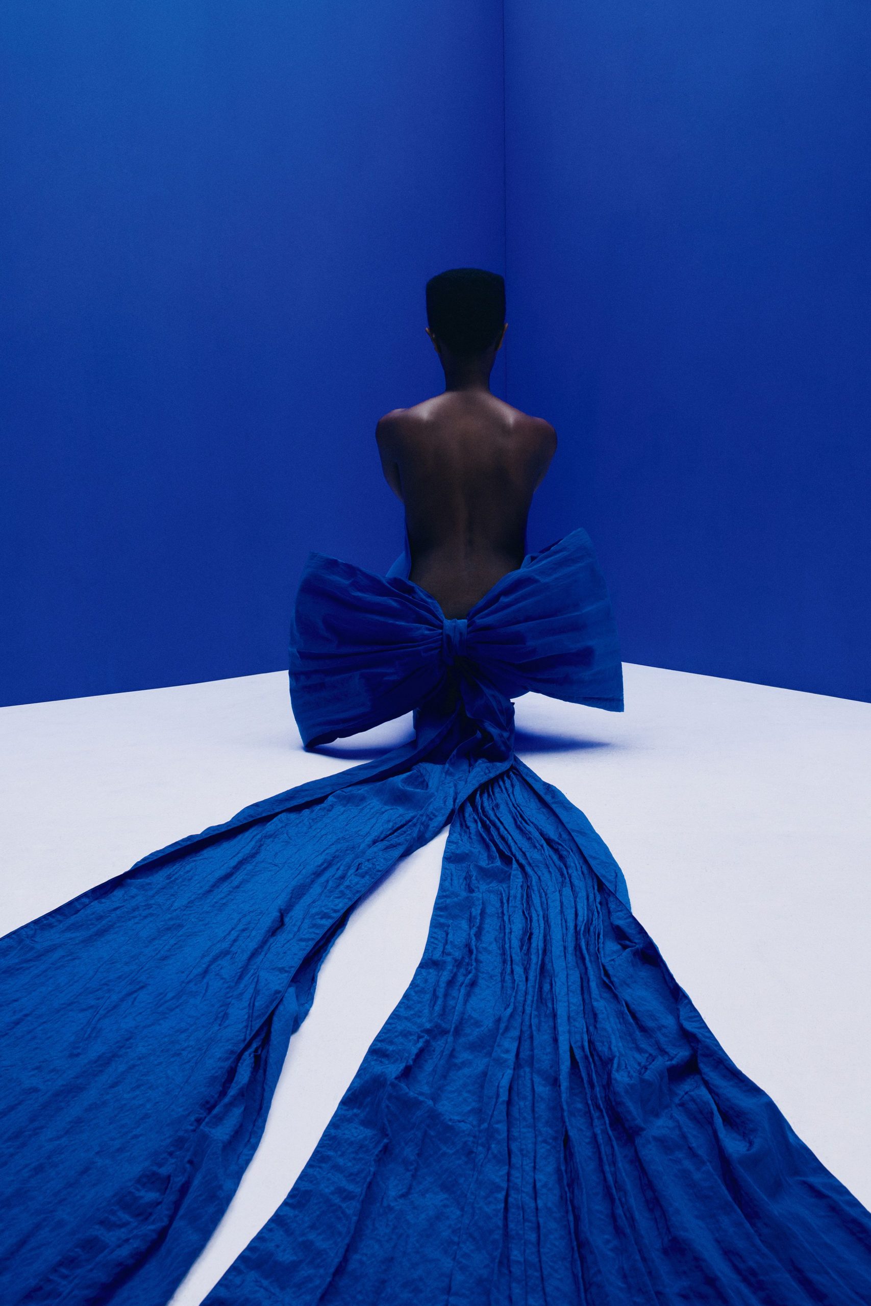 blue draped sleeveless gown