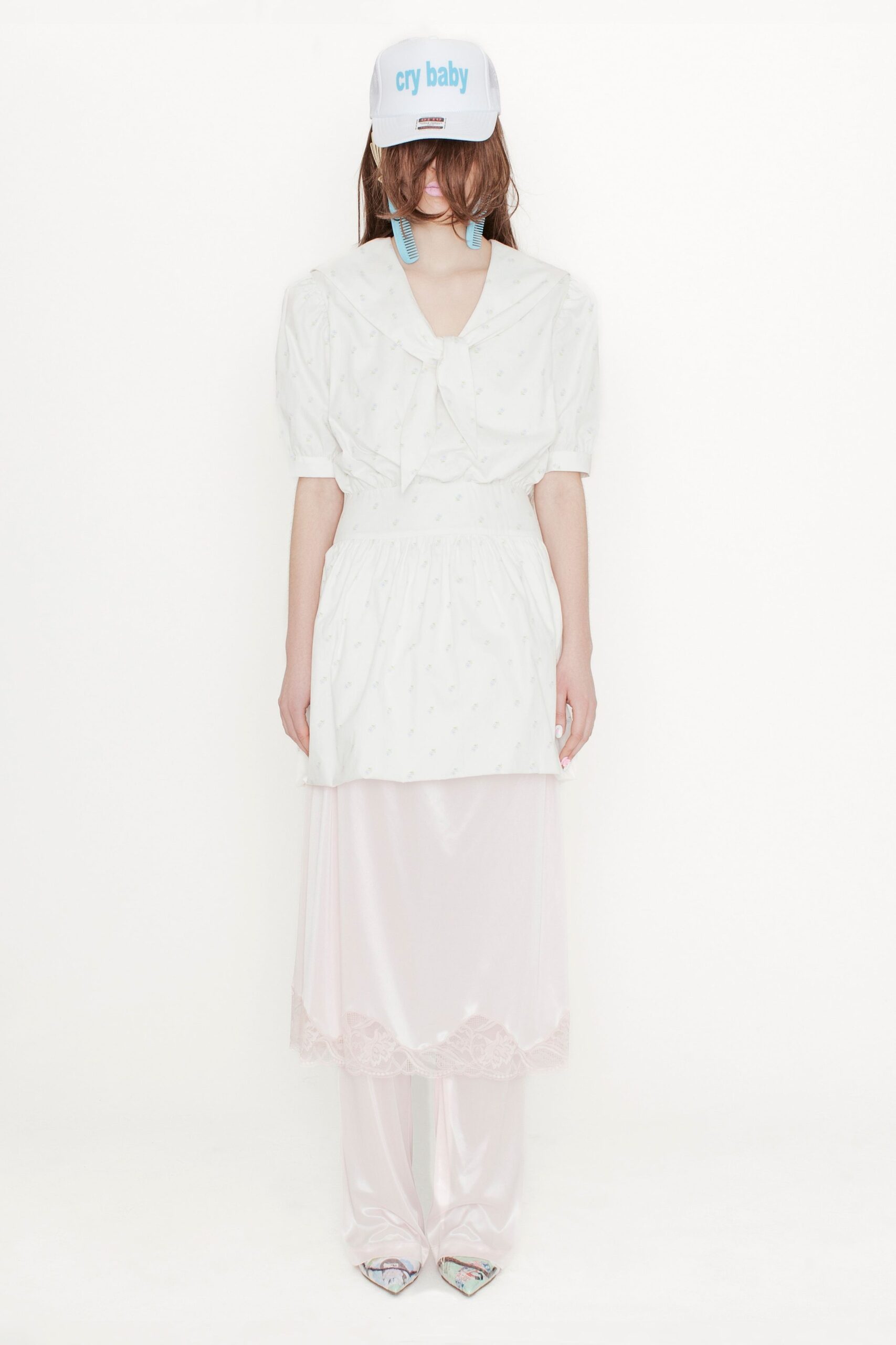 white relaxed top with pink skirt