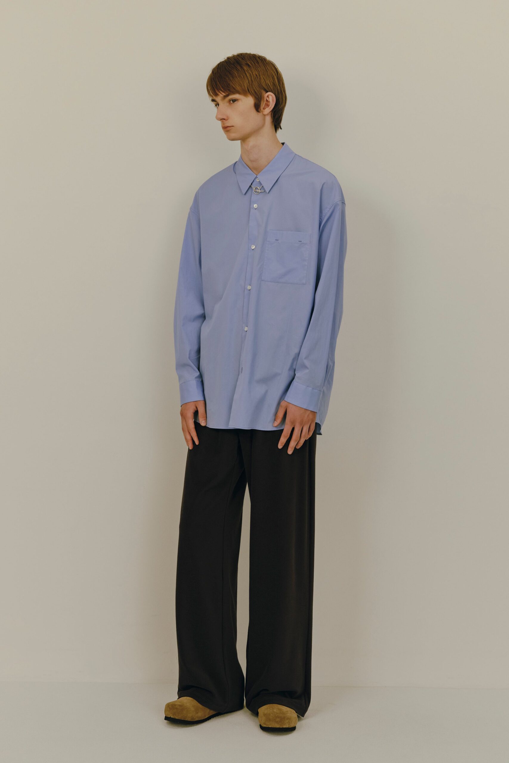 blue relaxed shirt with black pants