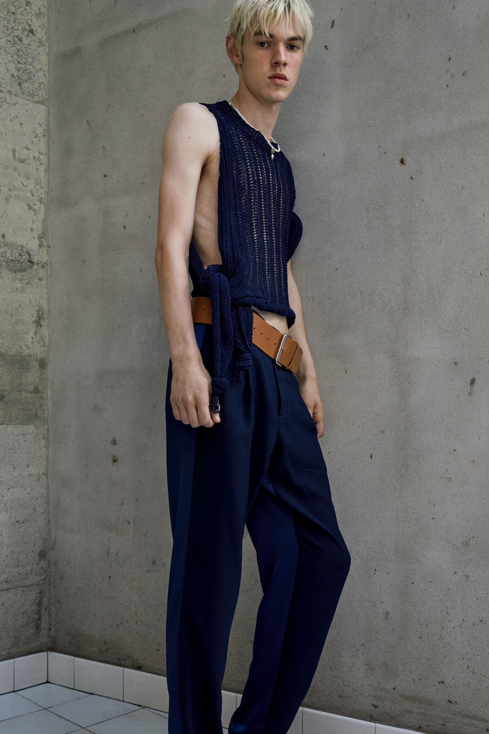 blue fitted sleeveless top with relaxed pants