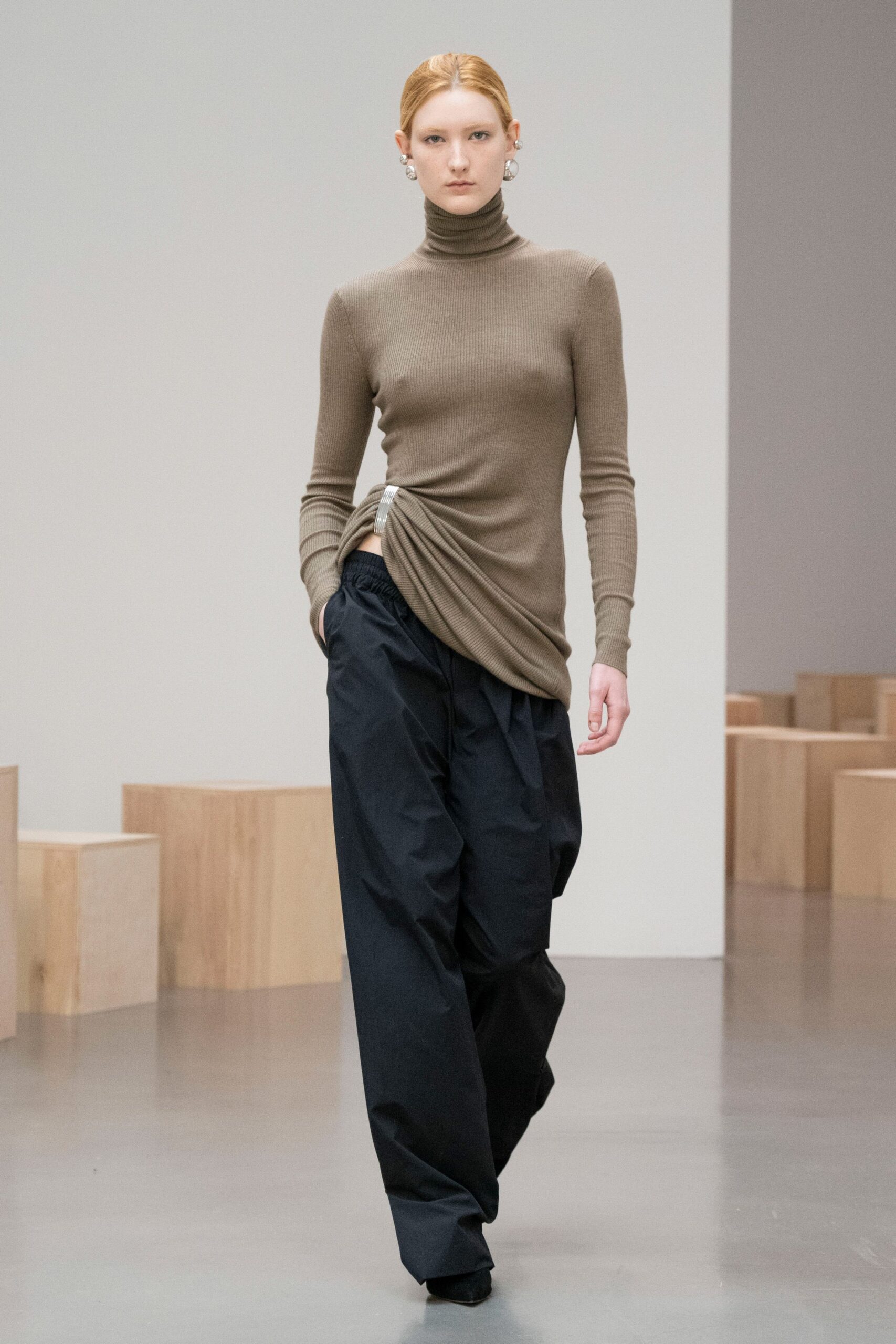 brown fitted top with black pants