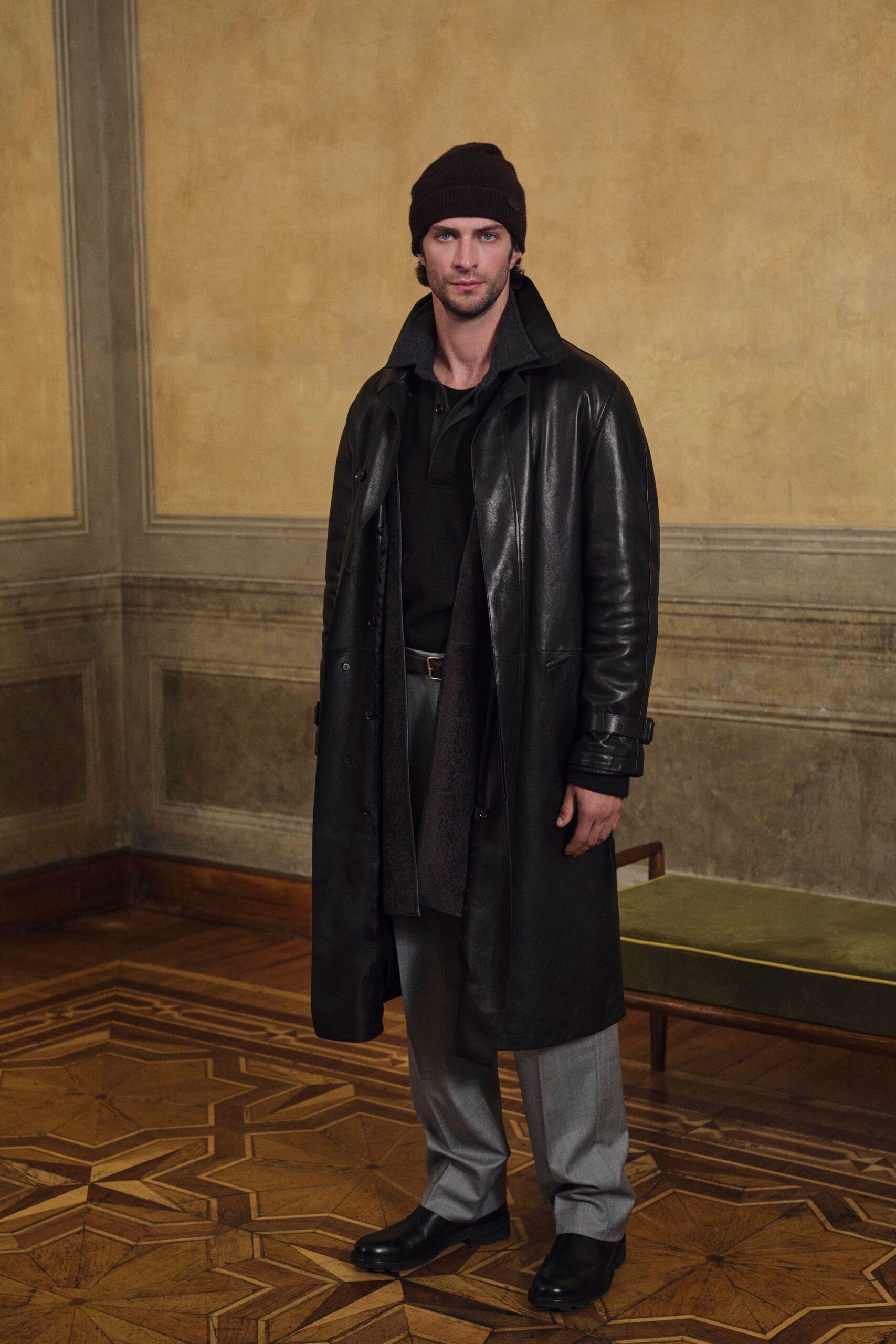black leather coat with gray pants