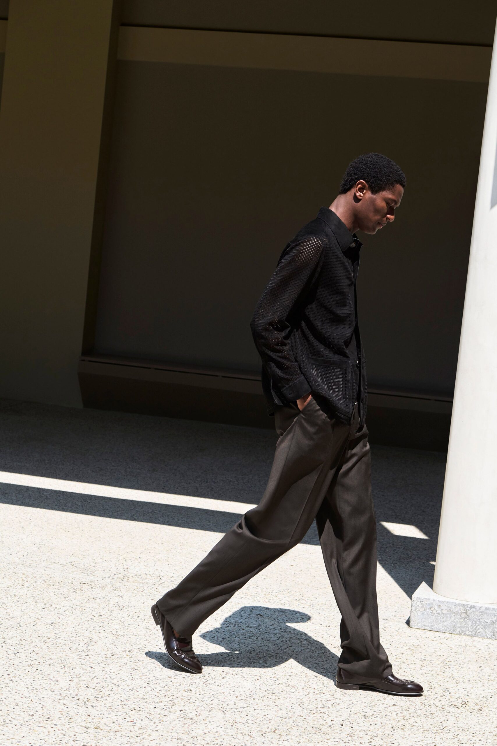 black shirt brown tailored pants