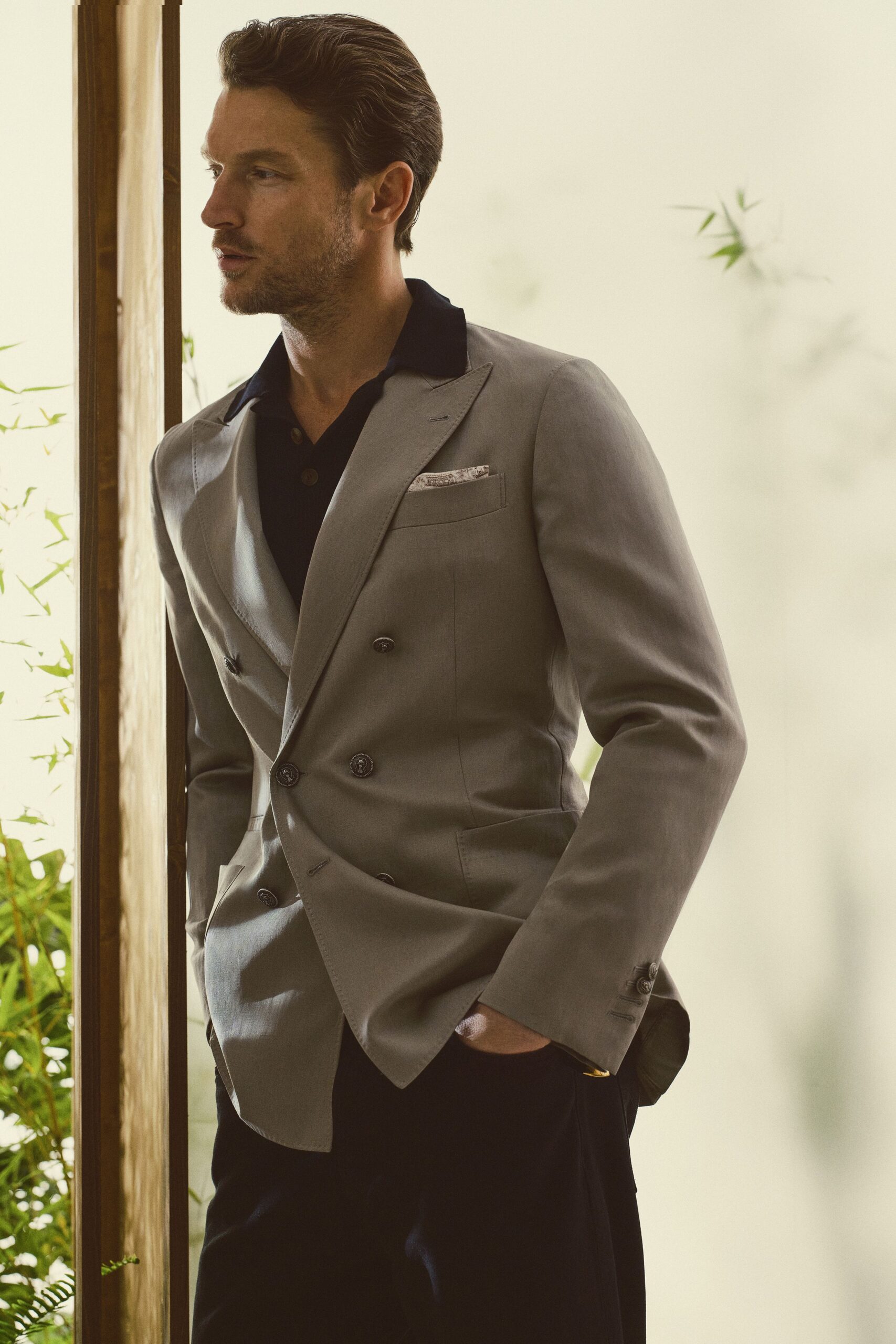 gray tailored blazer with black shirt