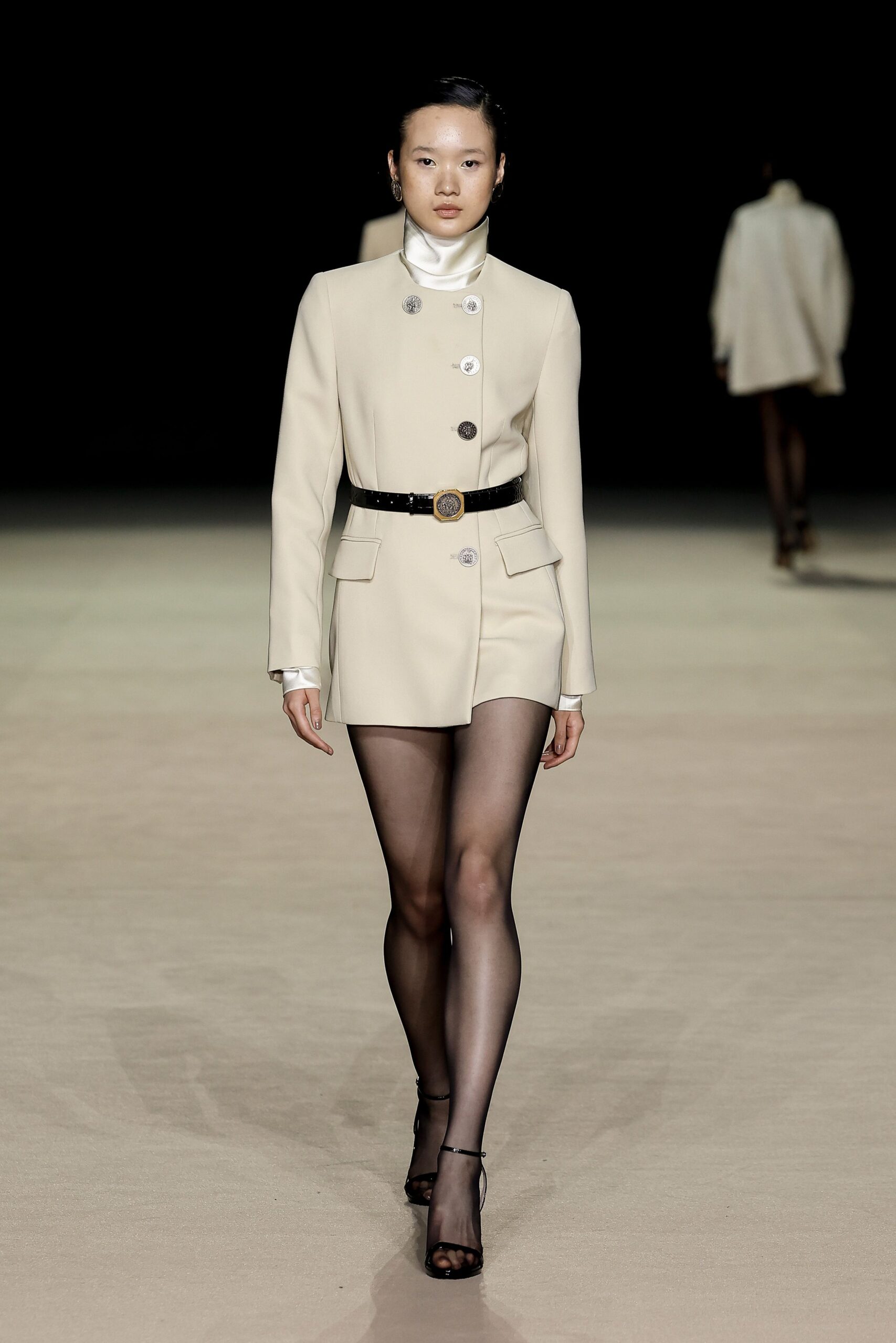 beige fitted blazer with black belt