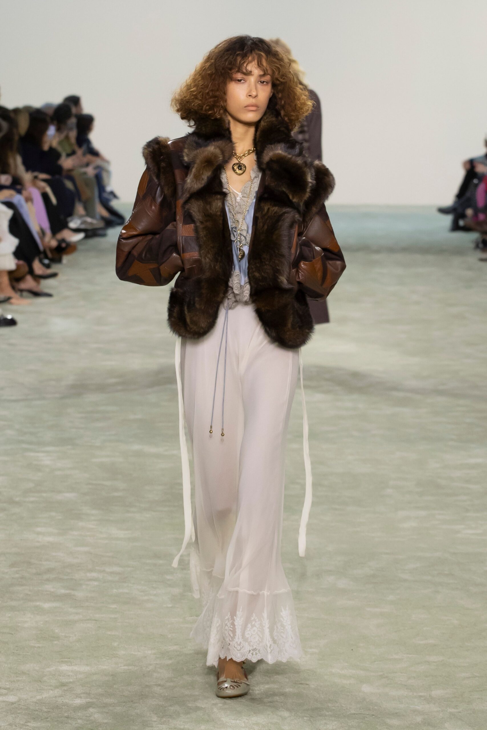 brown faux-fur jacket with blue top