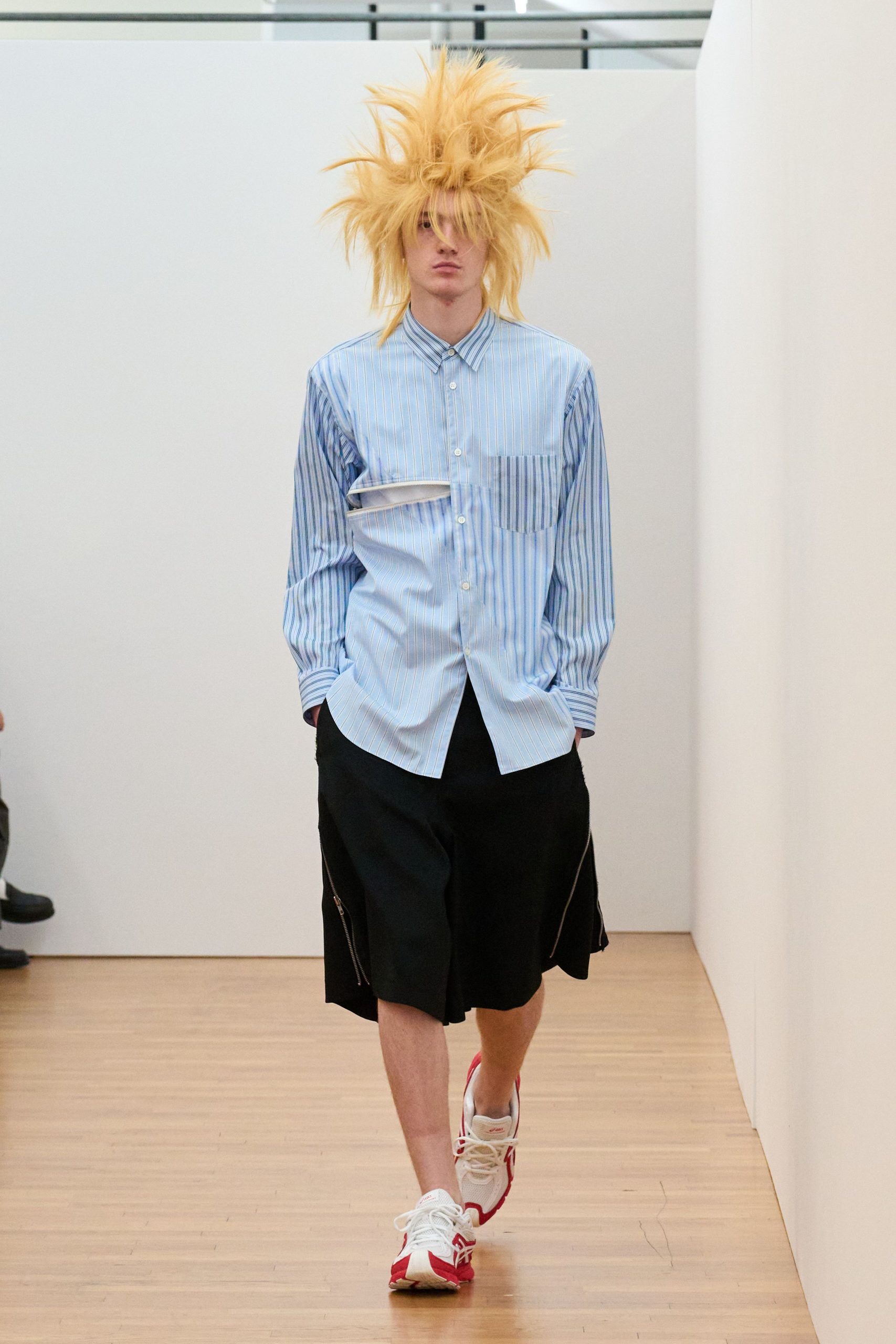 blue striped shirt and black shorts