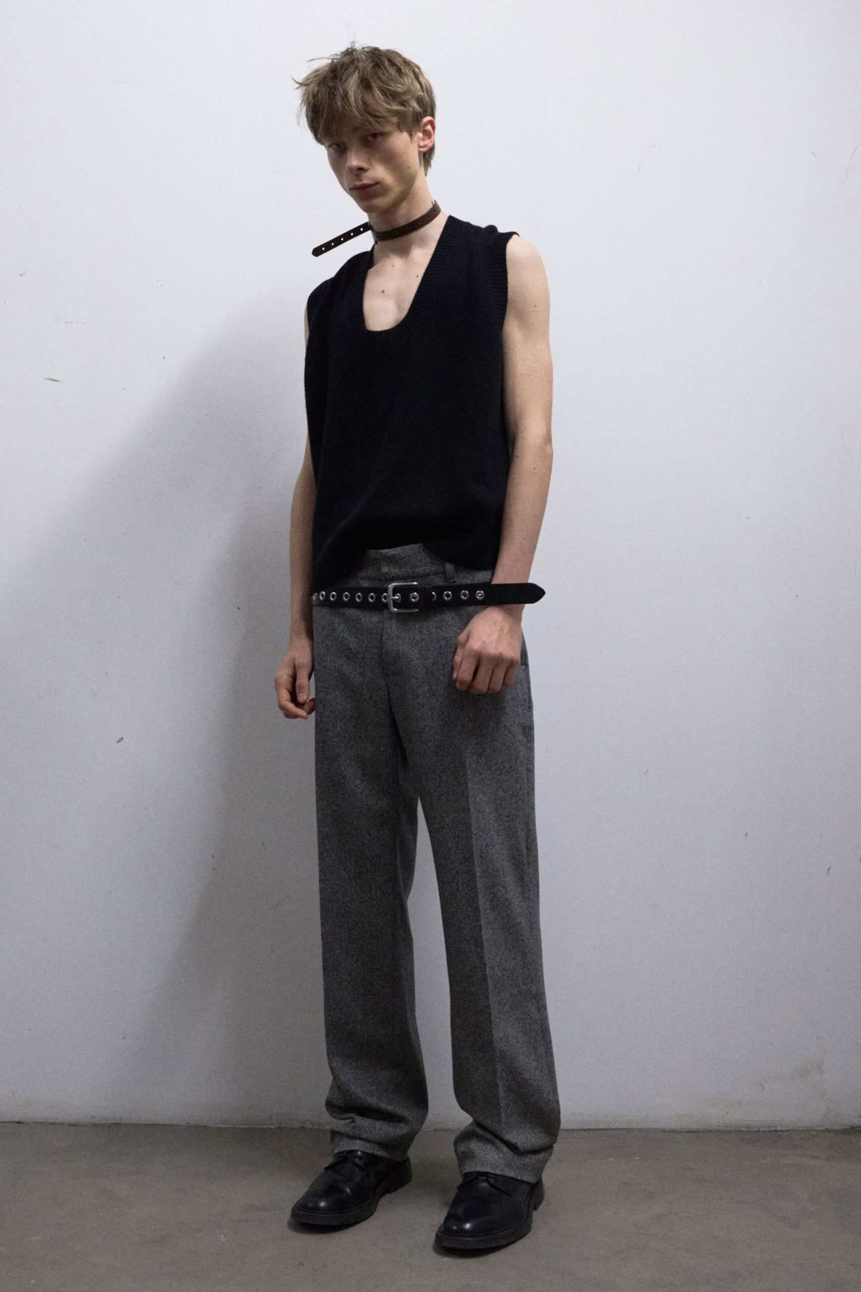 black sleeveless top gray pants