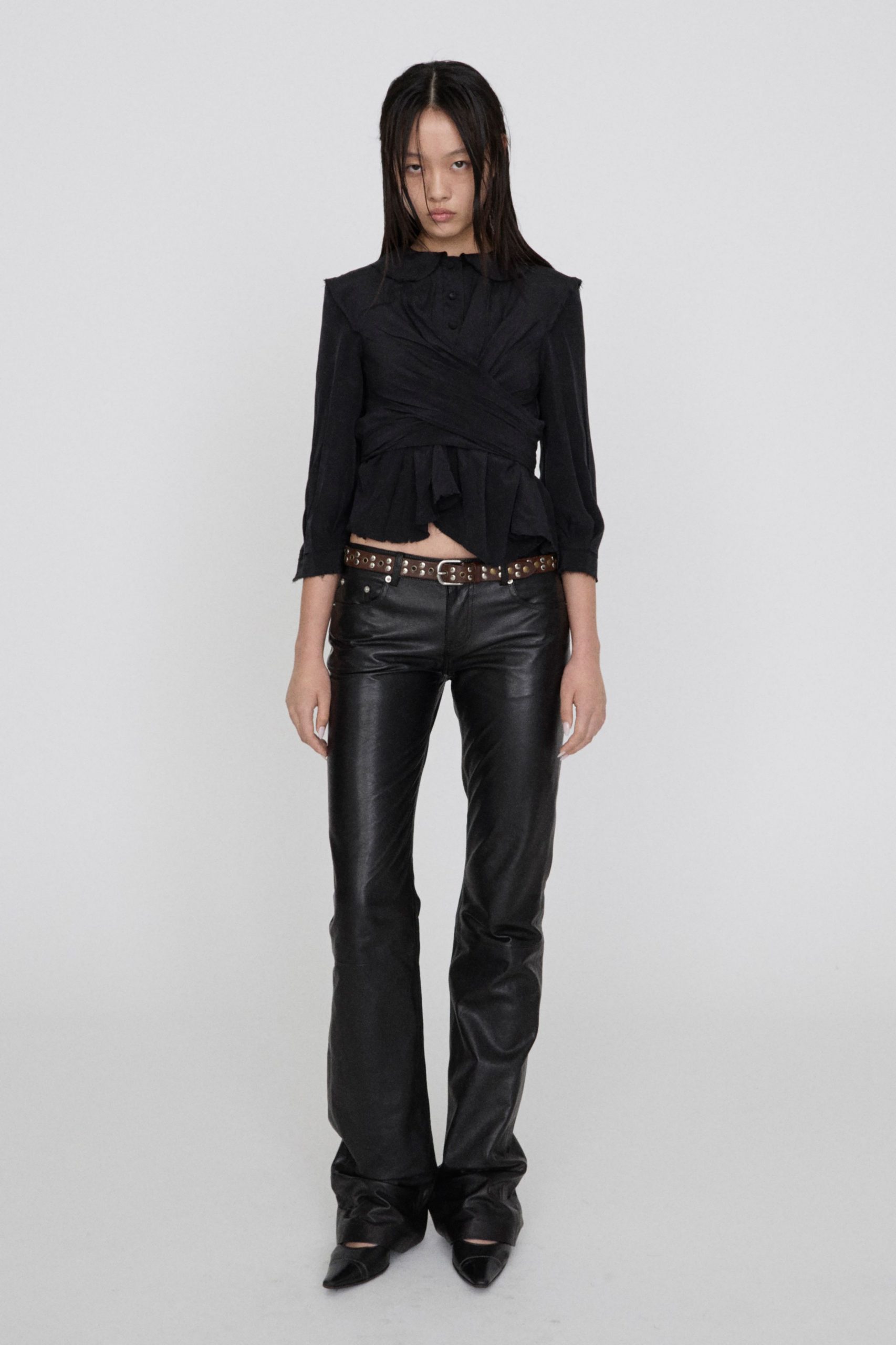black fitted top and leather pants